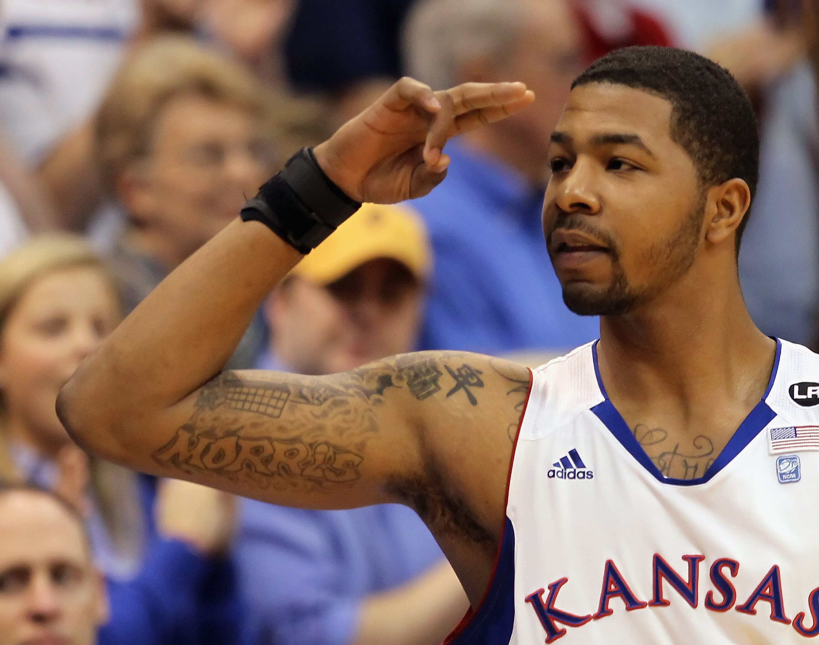 LAWRENCE, KS - MARCH 02:  Markieff Morris #21 of the Kansas Jayhawks salutes the crowd prior to the start of the game against the Texas A&M Aggies on March 2, 2011 at Allen Fieldhouse in Lawrence, Kansas.  (Photo by Jamie Squire/Getty Images)