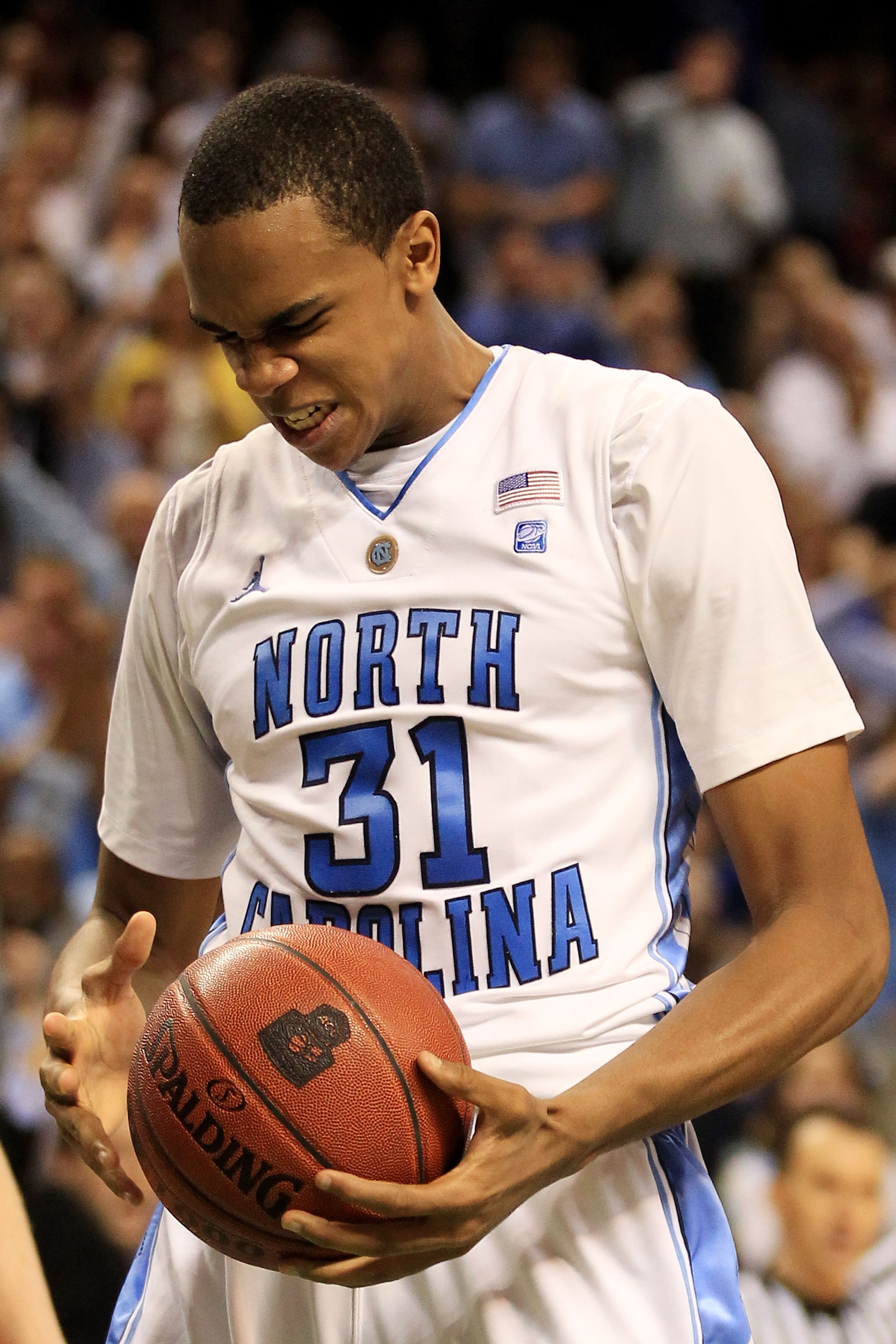GREENSBORO, NC - MARCH 12:  John Henson #31 of the North Carolina Tar Heels reacts during the second half against the Clemson Tigers in the semifinals of the 2011 ACC men's basketball tournament at the Greensboro Coliseum on March 12, 2011 in Greensboro,