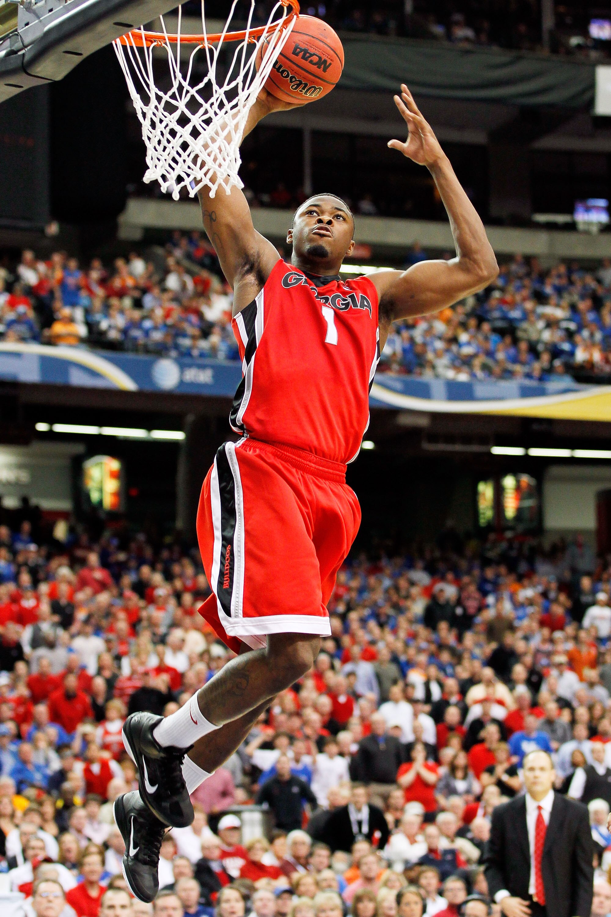 ATLANTA, GA - MARCH 11: Travis Leslie #1 of the Georgia Bulldogs dunks on the Alabama Crimson Tide during the quarterfinals of the SEC Men's Basketball Tournament at Georgia Dome on March 11, 2011 in Atlanta, Georgia.  (Photo by Kevin C. Cox/Getty Images)