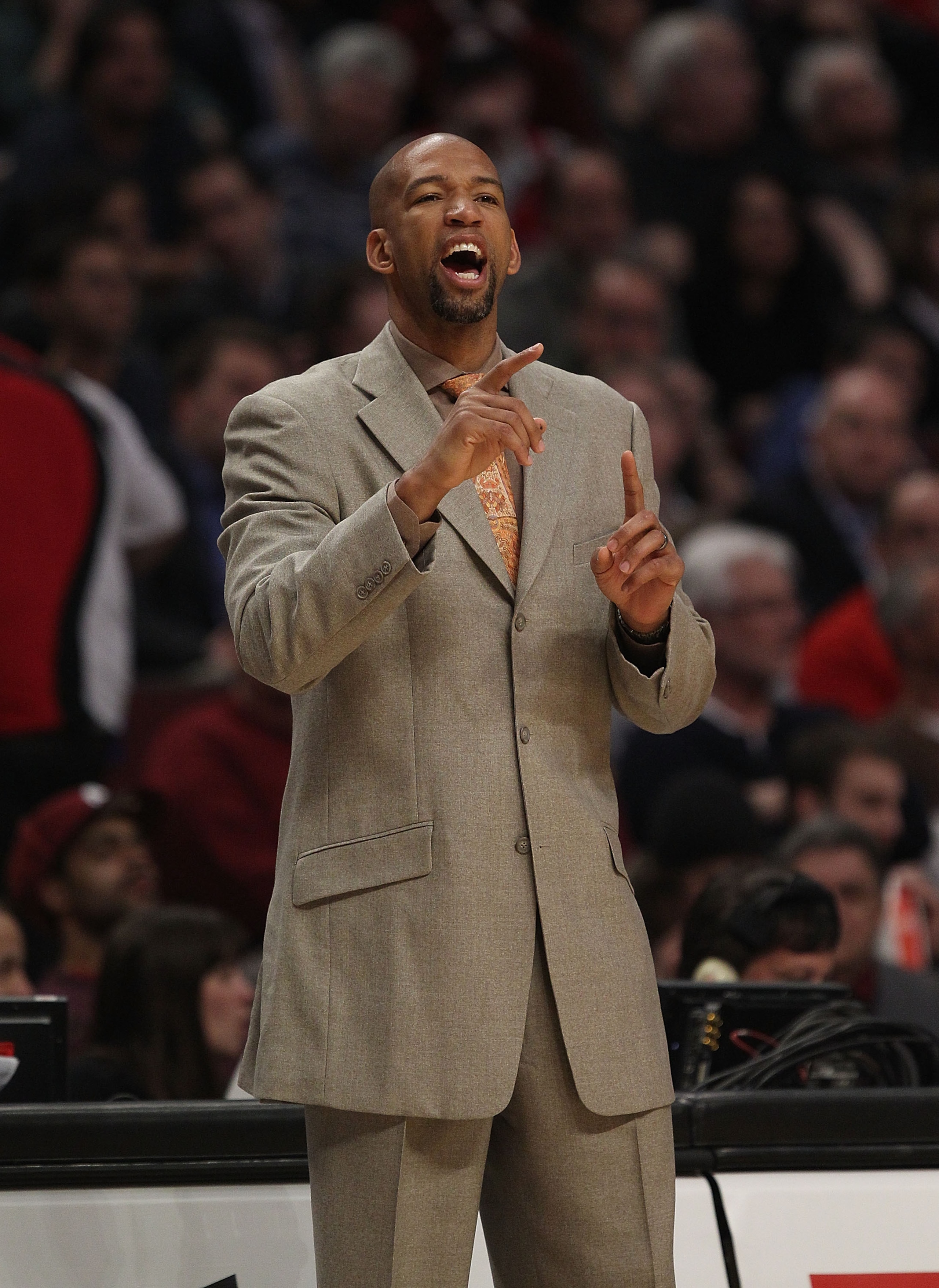 CHICAGO, IL - MARCH 07: Head coach Monty Williams of the New Orleans Hornets gives instructions to his team against the Chicago Bulls at the United Center on March 7, 2011 in Chicago, Illinois. The Bulls defeated the Hornets 85-77. NOTE TO USER: User expr
