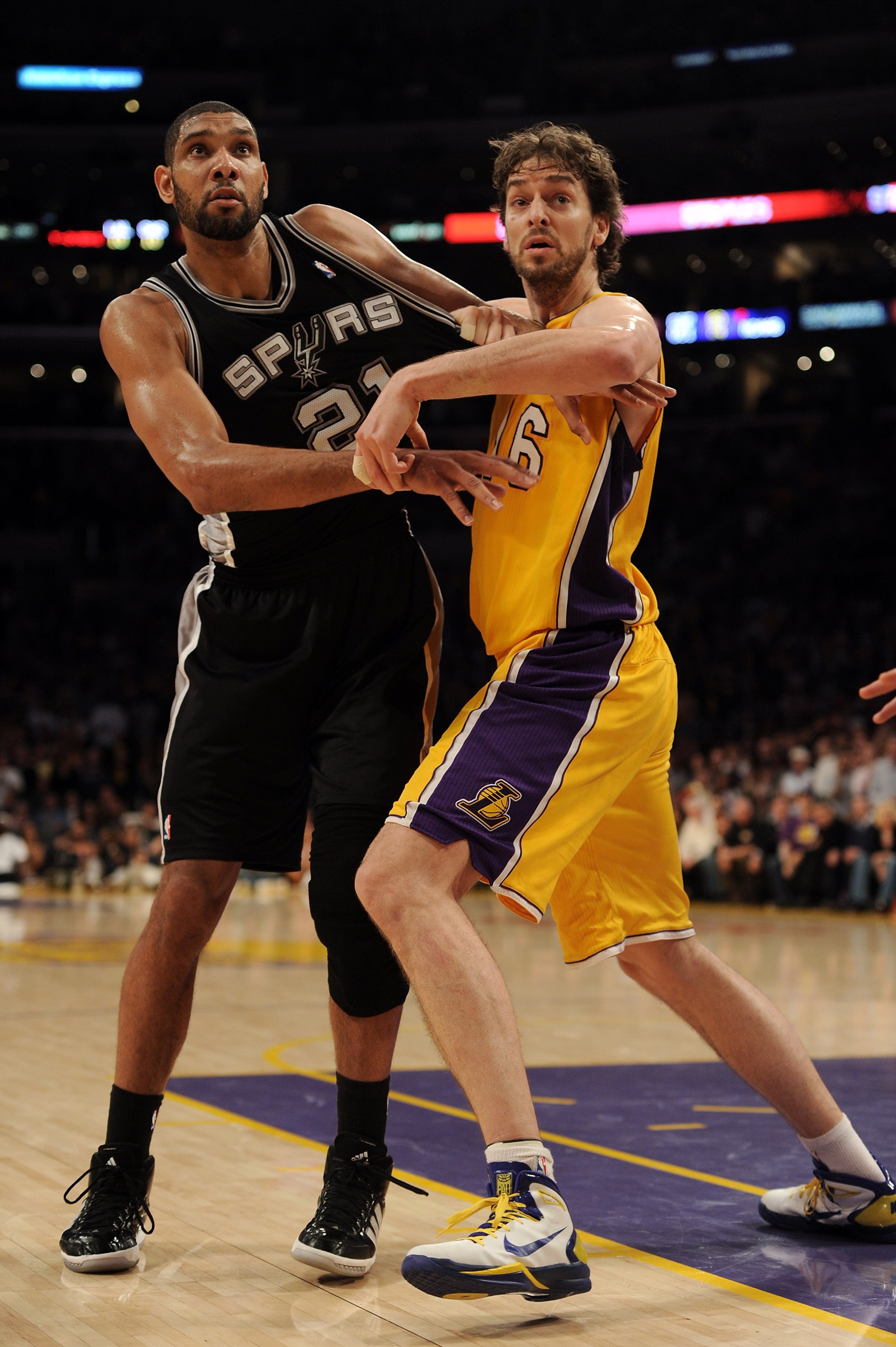 LOS ANGELES, CA - FEBRUARY 03:  Tim Duncan #21 of the San Antonio Spurs is guarded by Pau Gasol #16 of the Los Angeles Lakers at Staples Center on February 3, 2011 in Los Angeles, California.  NOTE TO USER: User expressly acknowledges and agrees that, by