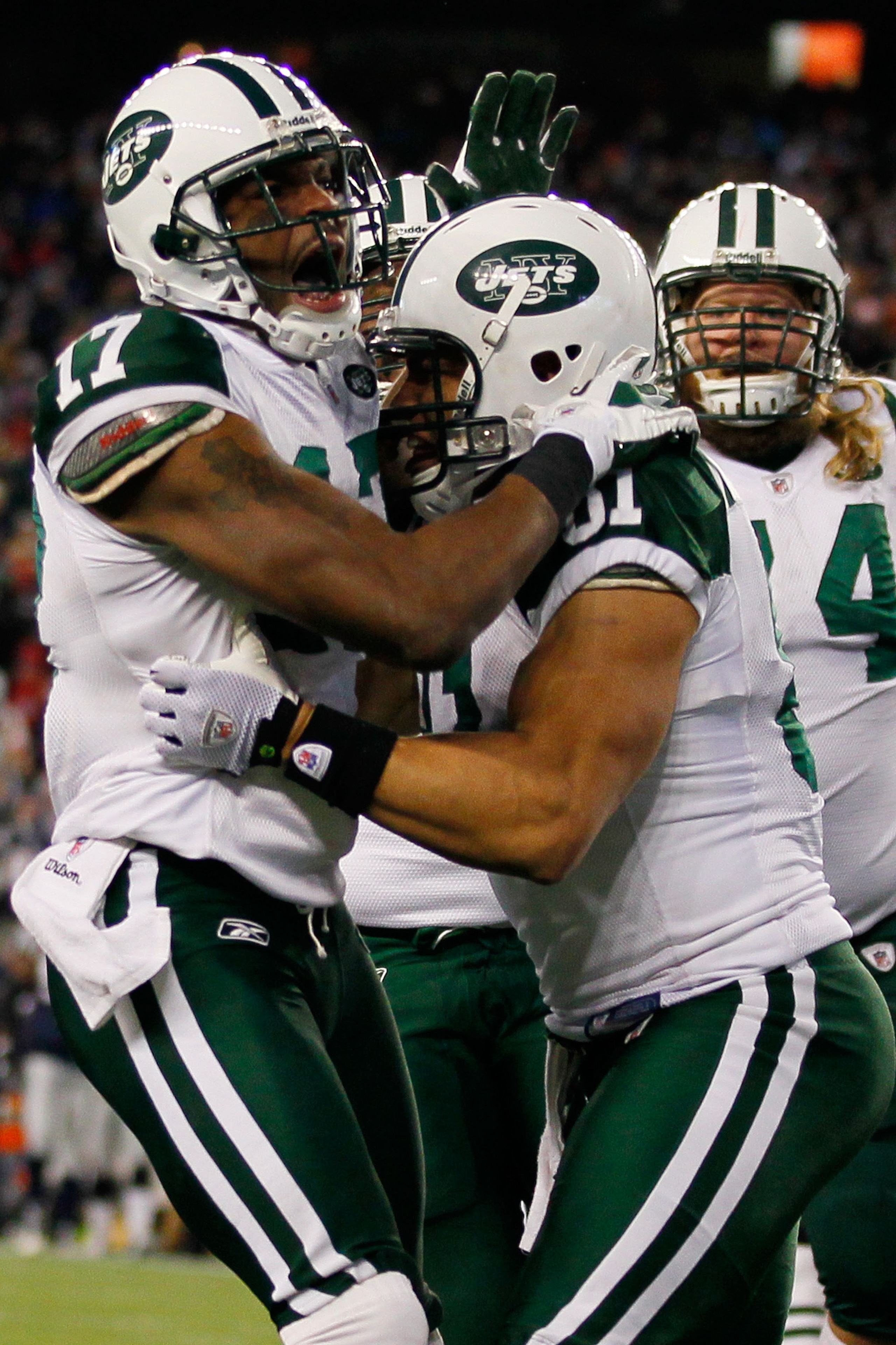 FOXBORO, MA - JANUARY 16:  Braylon Edwards #17 celebrates with Dustin Keller #81 of the New York Jets after Edwards scored a second quarter touchdown during their 2011 AFC divisional playoff game against the New England Patriots at Gillette Stadium on Jan