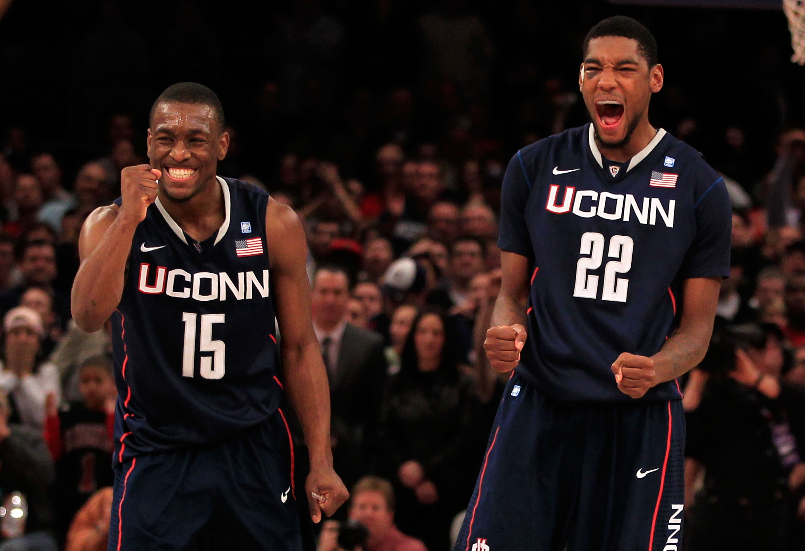 NEW YORK, NY - MARCH 12: Kemba Walker #15 and Roscoe Smith #22 of the Connecticut Huskies celebrate late in the game against the Louisville Cardinals during the championship of the 2011 Big East Men's Basketball Tournament presented by American Eagle Outf