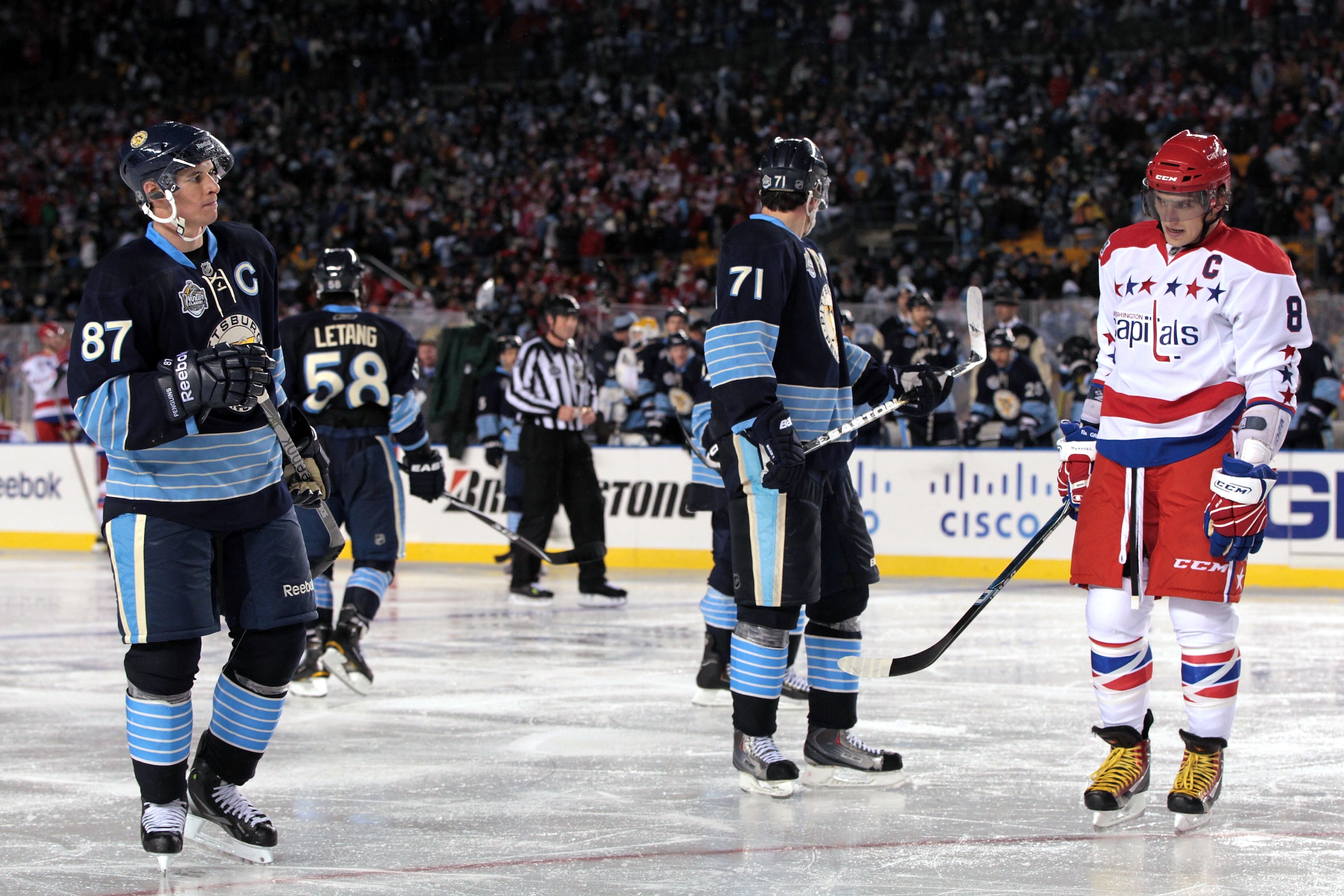 PITTSBURGH, PA - JANUARY 01: Alex Ovechkin #8 of the Washington Capitals exchanges glances with Sidney Crosby #81 of the Pittsburgh Penguins during the 2011 NHL Bridgestone Winter Classic at Heinz Field on January 1, 2011 in Pittsburgh, Pennsylvania. Was PITTSBURGH, PA - JANUARY 01: Alex Ovechkin #8 of the Washington Capitals exchanges glances with Sidney Crosby #81 of the Pittsburgh Penguins during the 2011 NHL Bridgestone Winter Classic at Heinz Field on January 1, 2011 in Pittsburgh, Pennsylvania. Was
