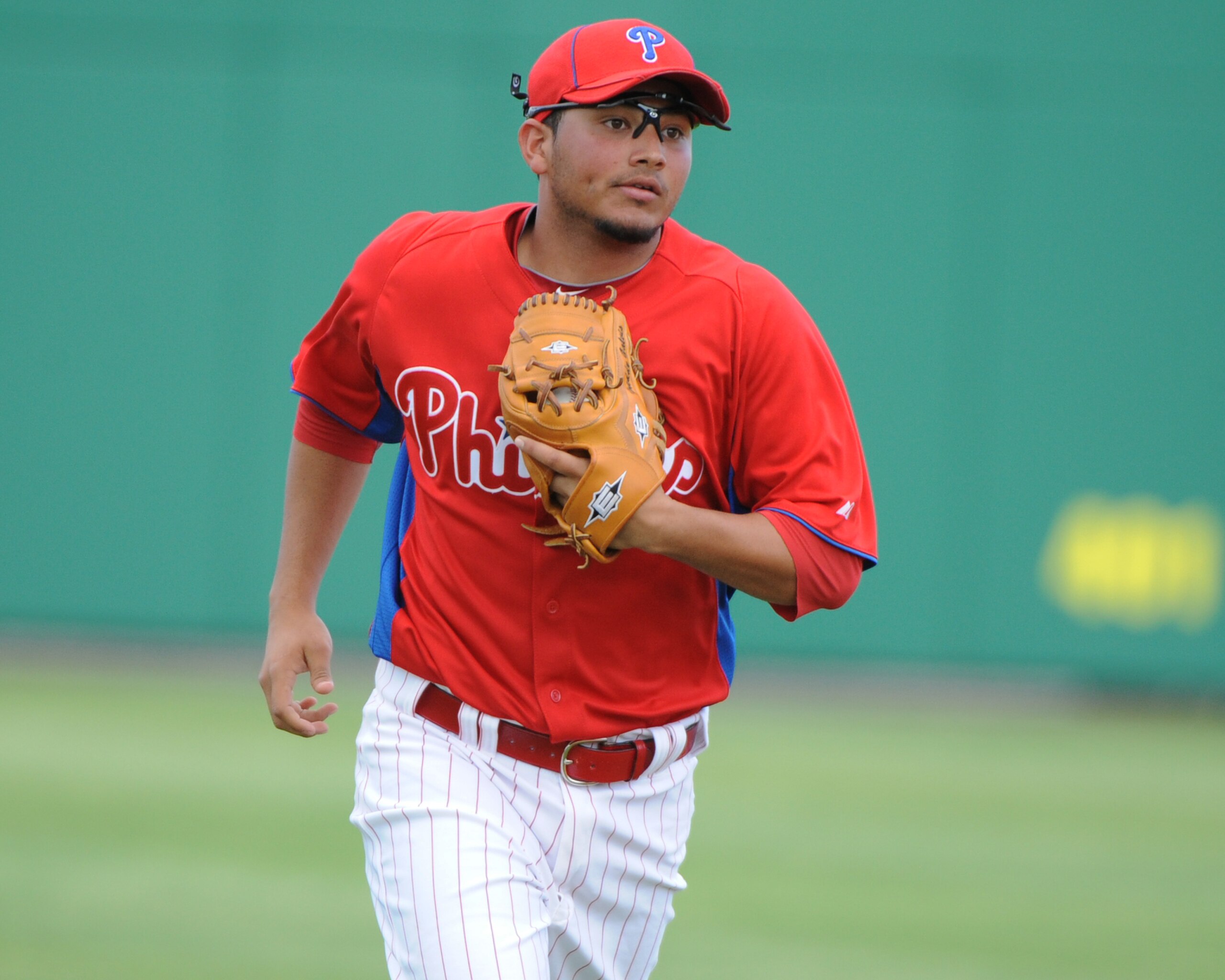 CLEARWATER, FL - FEBRUARY 24:  Infielder Freddy Galvis #71 of the Philadelphia Phillies runs to the dugout during play against the Florida State Seminoles February 24, 2011 at Bright House Field in Clearwater, Florida.  (Photo by Al Messerschmidt/Getty Im
