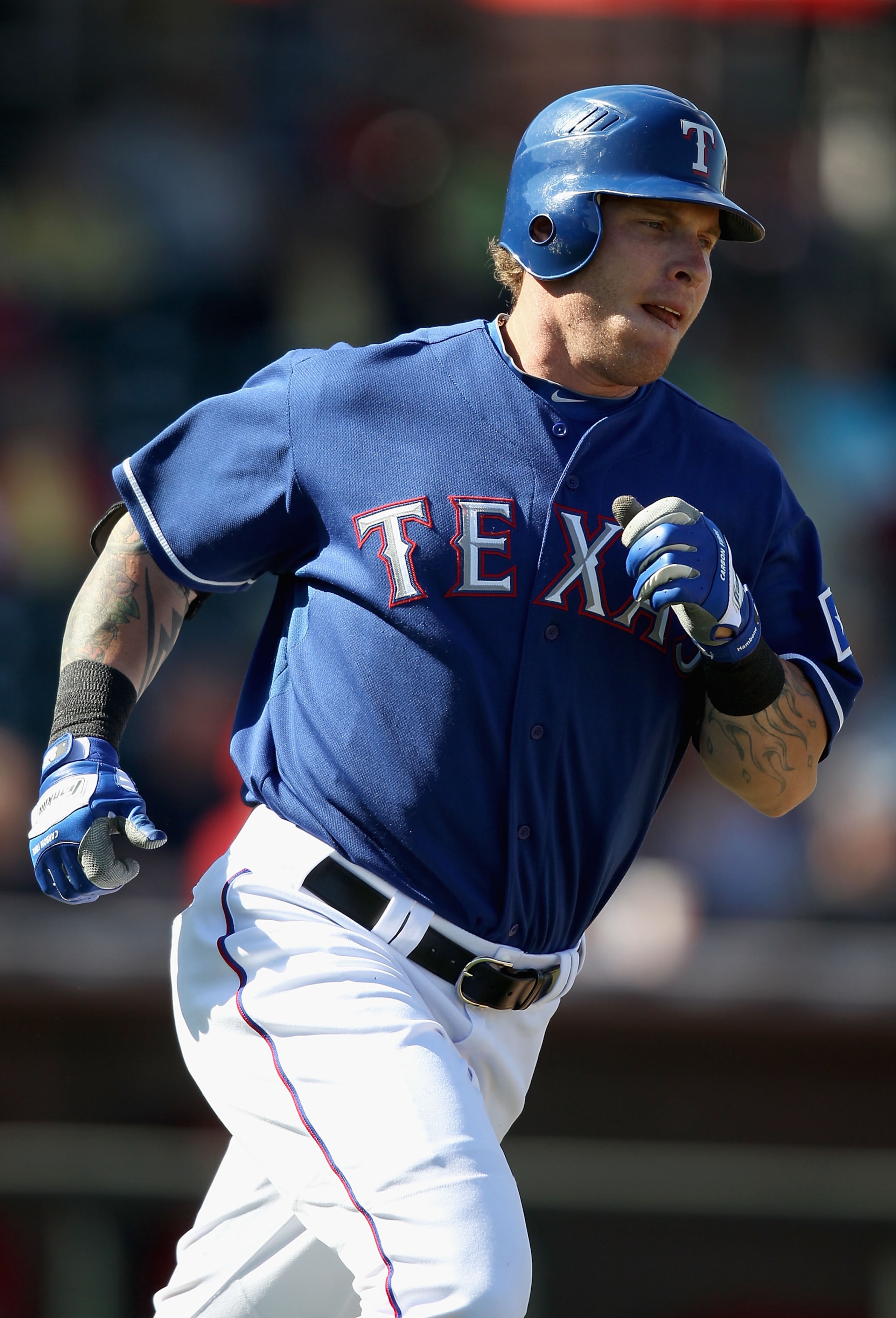 SURPRISE, AZ - MARCH 02:  Josh Hamilton #32 of the Texas Rangers runs to first base during the spring training game against the Los Angeles Angels of Anaheim at Surprise Stadium on March 2, 2011 in Surprise, Arizona.  (Photo by Christian Petersen/Getty Im
