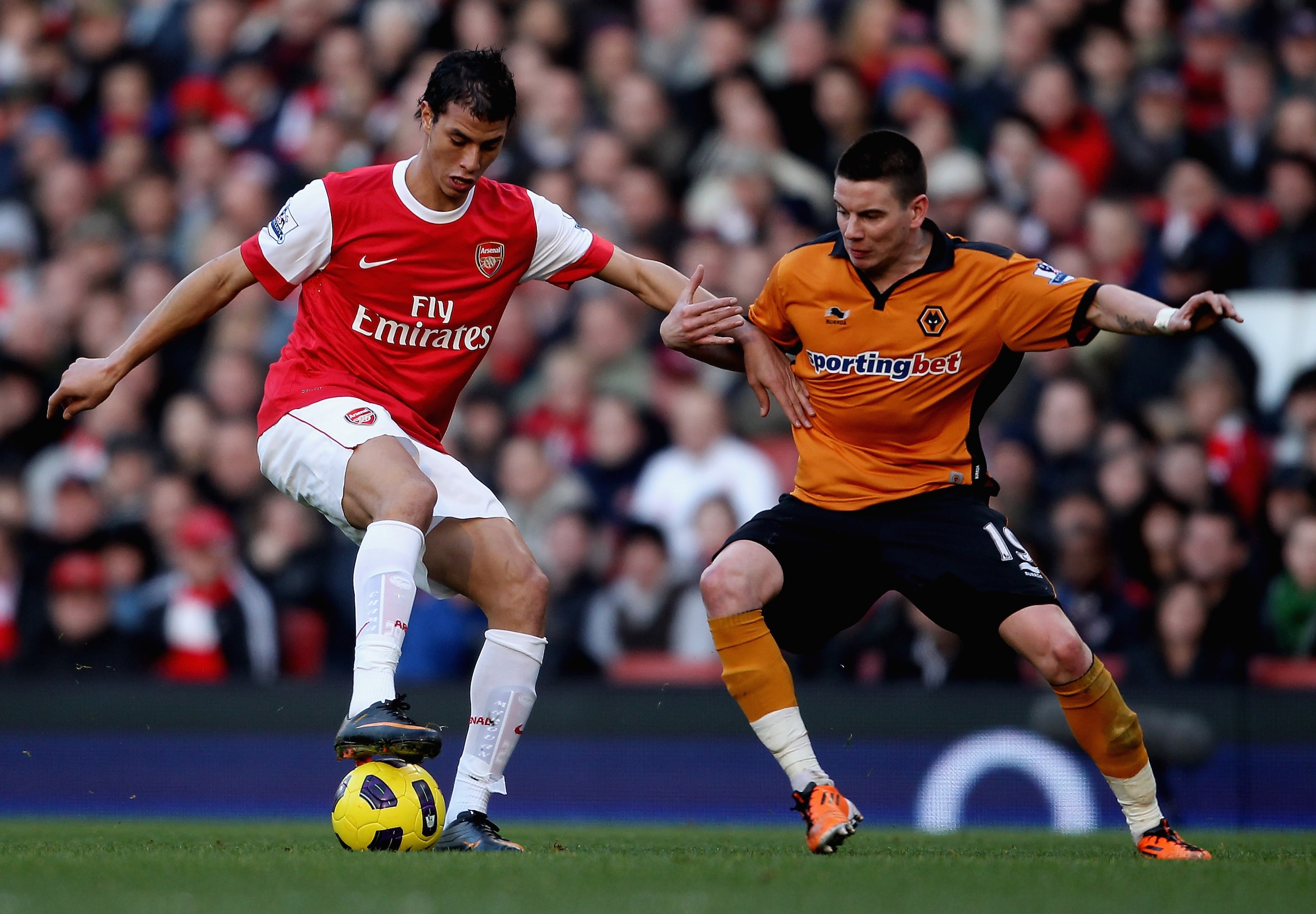 LONDON, ENGLAND - FEBRUARY 12: Adam Hammill of Wolves (R) in action with Marouane Chamakh of Arsenal during the Barclays Premier League match between Arsenal and Wolverhampton Wanderers on February 12, 2011 in London, England. (Photo by Scott Heavey/Get LONDON, ENGLAND - FEBRUARY 12: Adam Hammill of Wolves (R) in action with Marouane Chamakh of Arsenal during the Barclays Premier League match between Arsenal and Wolverhampton Wanderers on February 12, 2011 in London, England. (Photo by Scott Heavey/Get