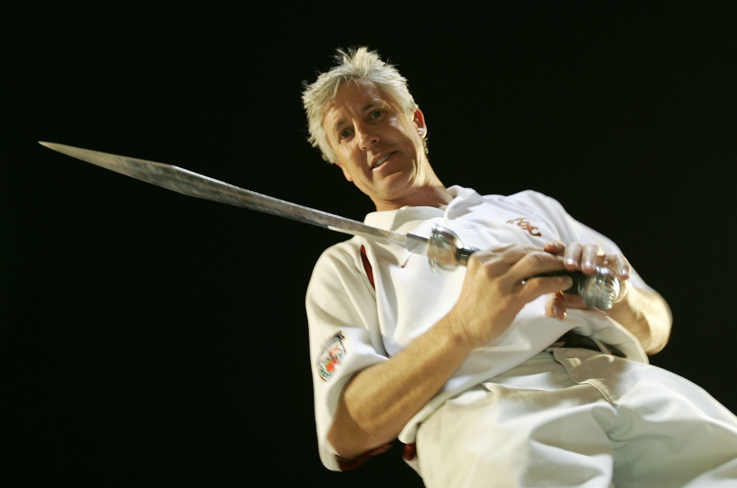 MIAMI - JANUARY 4: Head coach Pete Carroll of the USC Trojans holds the sword he used to direct the band after defeating the Oklahoma Sooners 55-19 to win the FedEx Orange Bowl 2005 National Championship on January 4, 2005 at Pro Player Stadium in Miami, MIAMI - JANUARY 4: Head coach Pete Carroll of the USC Trojans holds the sword he used to direct the band after defeating the Oklahoma Sooners 55-19 to win the FedEx Orange Bowl 2005 National Championship on January 4, 2005 at Pro Player Stadium in Miami,