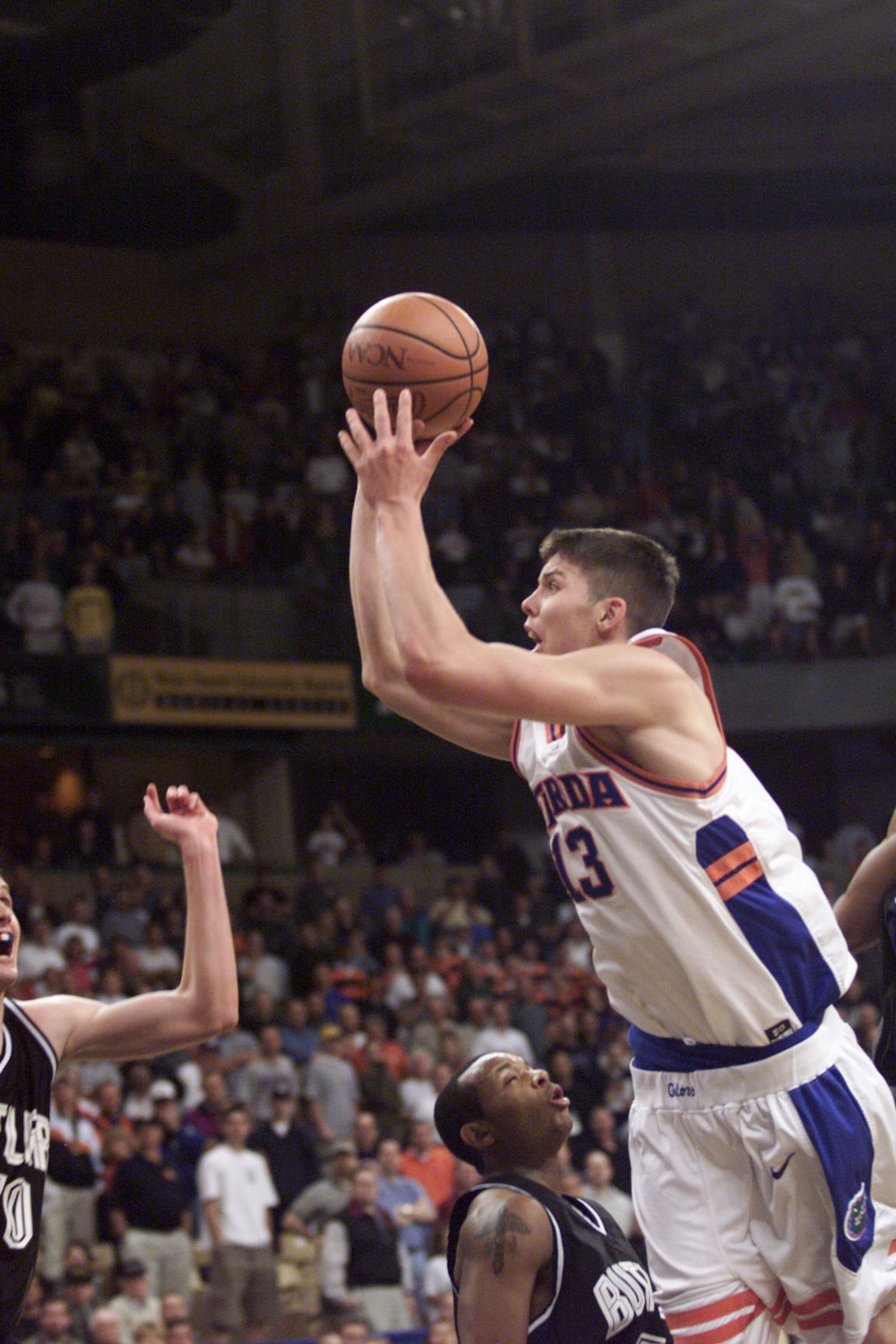 17 Mar 2000: Forward Mike Miller #13 of the Florida Gators launches the game winning shot to lead Florida to a 69-68 overtime win over the Butler Bulldogs during their first-round NCAA East Regional game at Lawrence Joel Coliseum in Winston-Salem, North C