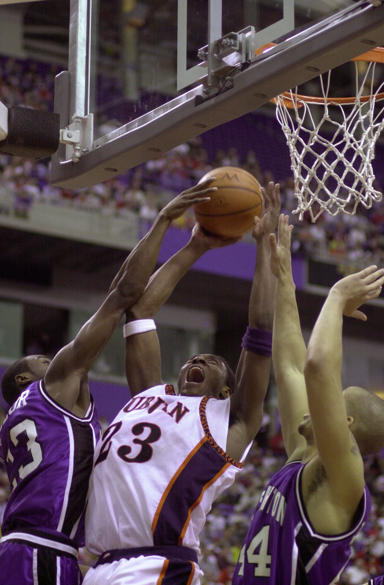 16 Mar 2000: Daymeon Fishback #23 of Auburn takes a shot as Terrell Taylor #23 and Donnie Johnson #44 of Creighton defend during the first round of NCAA regional action at the Hubert H. Humphrey Metrodome in Minneapolis, Minnesota. Auburn won 72-69. DIGIT