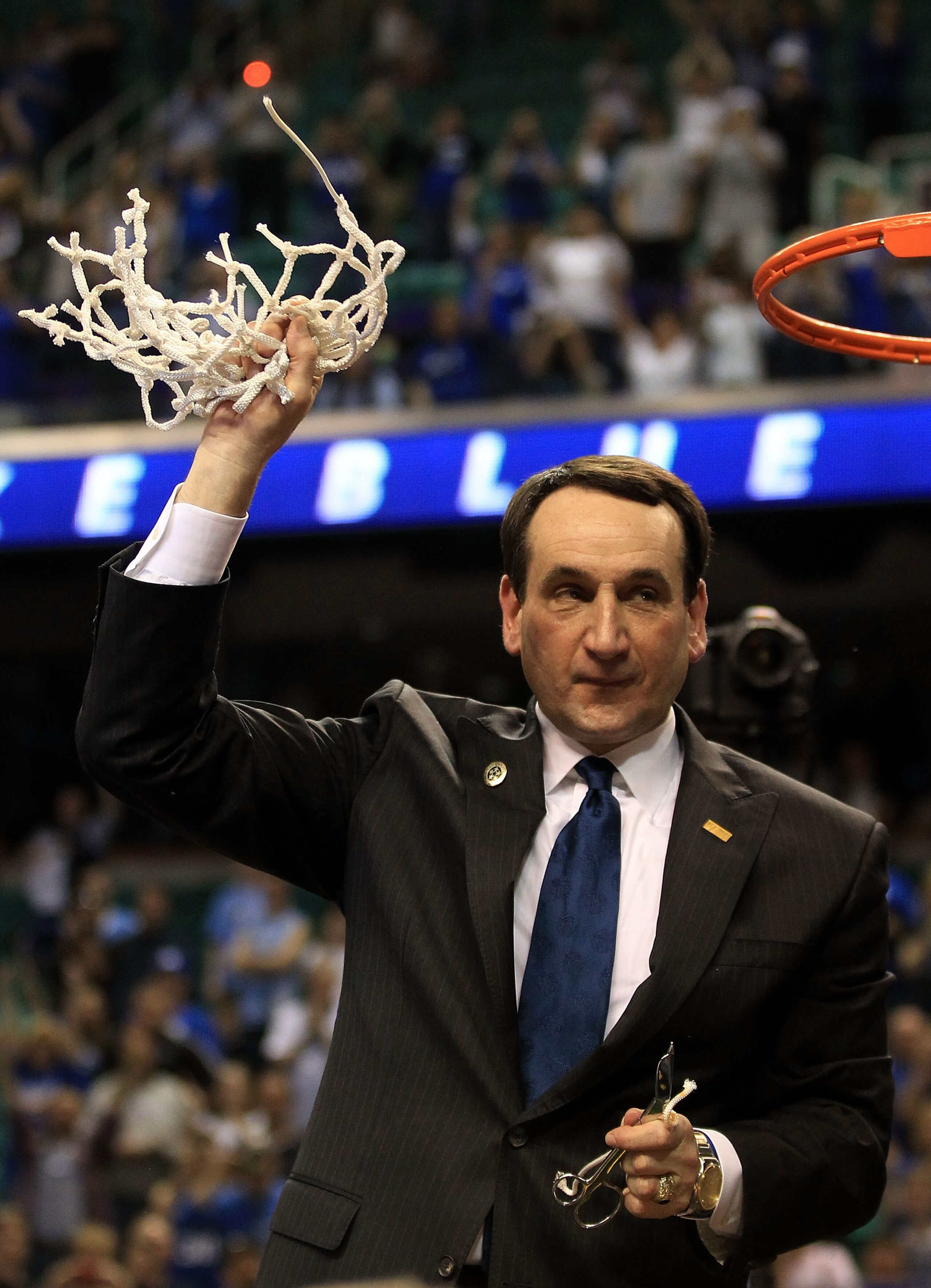 GREENSBORO, NC - MARCH 13:  Head coach Mike Krzyzewski of the Duke Blue Devils cuts down the net after defeating the North Carolina Tar Heels 75-58 in the championship game of the 2011 ACC men's basketball tournament at the Greensboro Coliseum on March 13