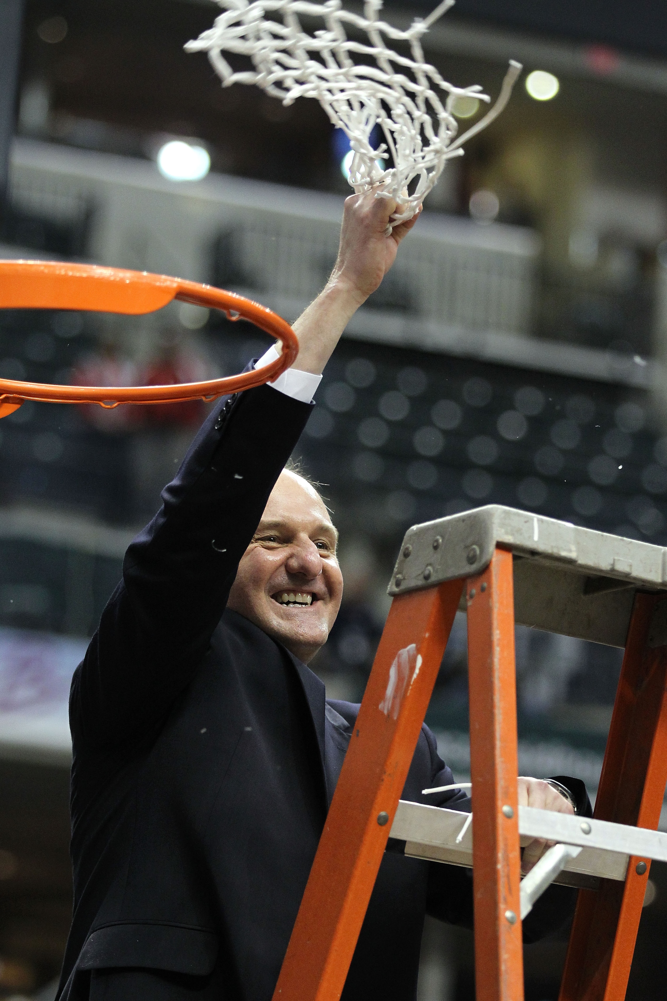 INDIANAPOLIS, IN - MARCH 13:  Head coach Thad Matta of the Ohio State Buckeyes celebrates after he cut down the net following their 71-60 win against the Penn State Nittany Lions during the championship game of the 2011 Big Ten Men's Basketball Tournament