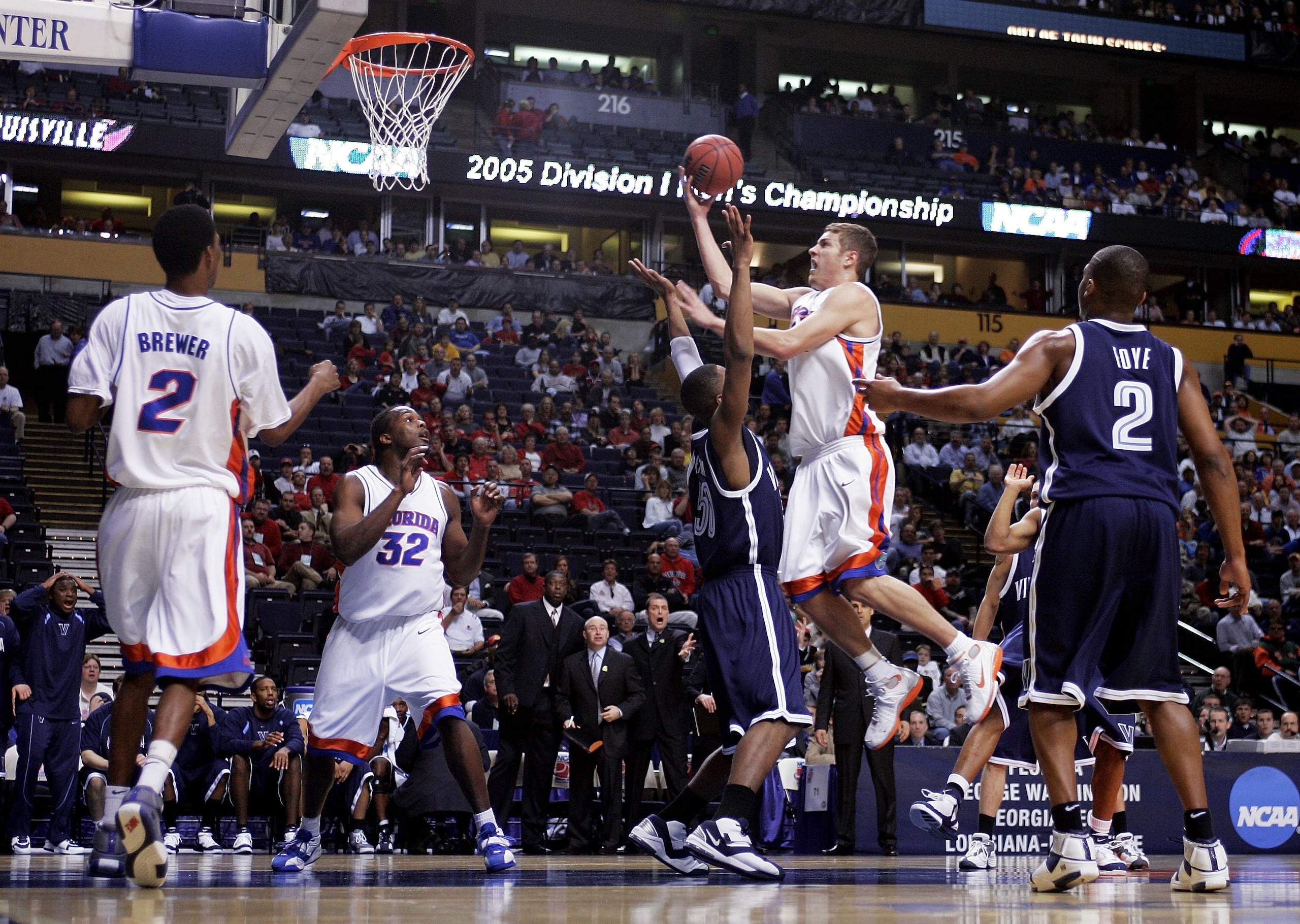 NASHVILLE, TN - MARCH 20:  David Lee #24 of the Florida Gators goes through Will Sheridan #50 of the Villanova Wildcats on his way to the basket in the second round of the NCAA Division I Men's Basketball Championship at the Gaylord Entertainment Center o