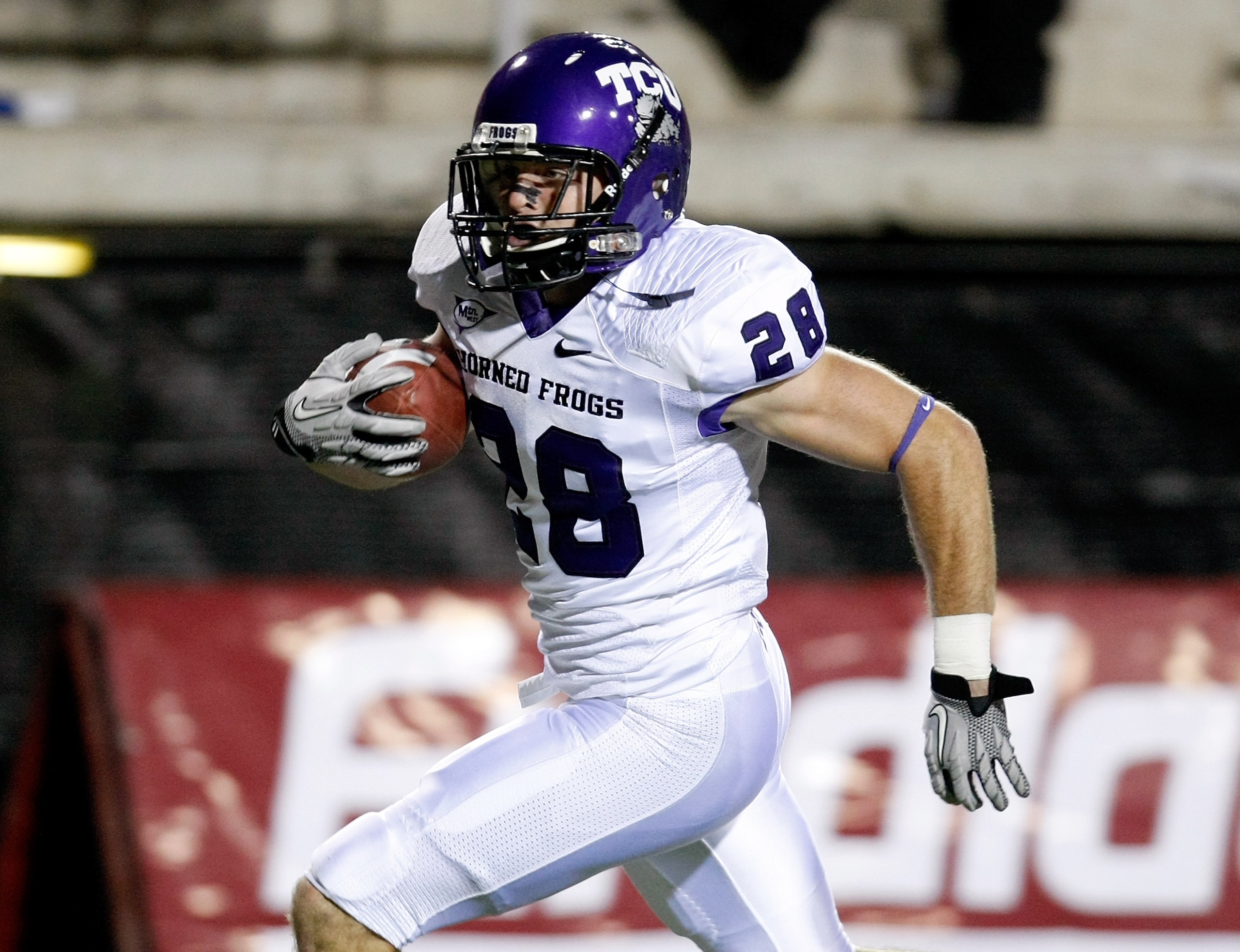 LAS VEGAS - OCTOBER 30: Colin Jones #28 of the Texas Christian University Horned Frogs runs for a 30-yard touchdown after making an interception against the UNLV Rebels during the second quarter of their game at Sam Boyd Stadium October 30, 2010 in Las V LAS VEGAS - OCTOBER 30: Colin Jones #28 of the Texas Christian University Horned Frogs runs for a 30-yard touchdown after making an interception against the UNLV Rebels during the second quarter of their game at Sam Boyd Stadium October 30, 2010 in Las V