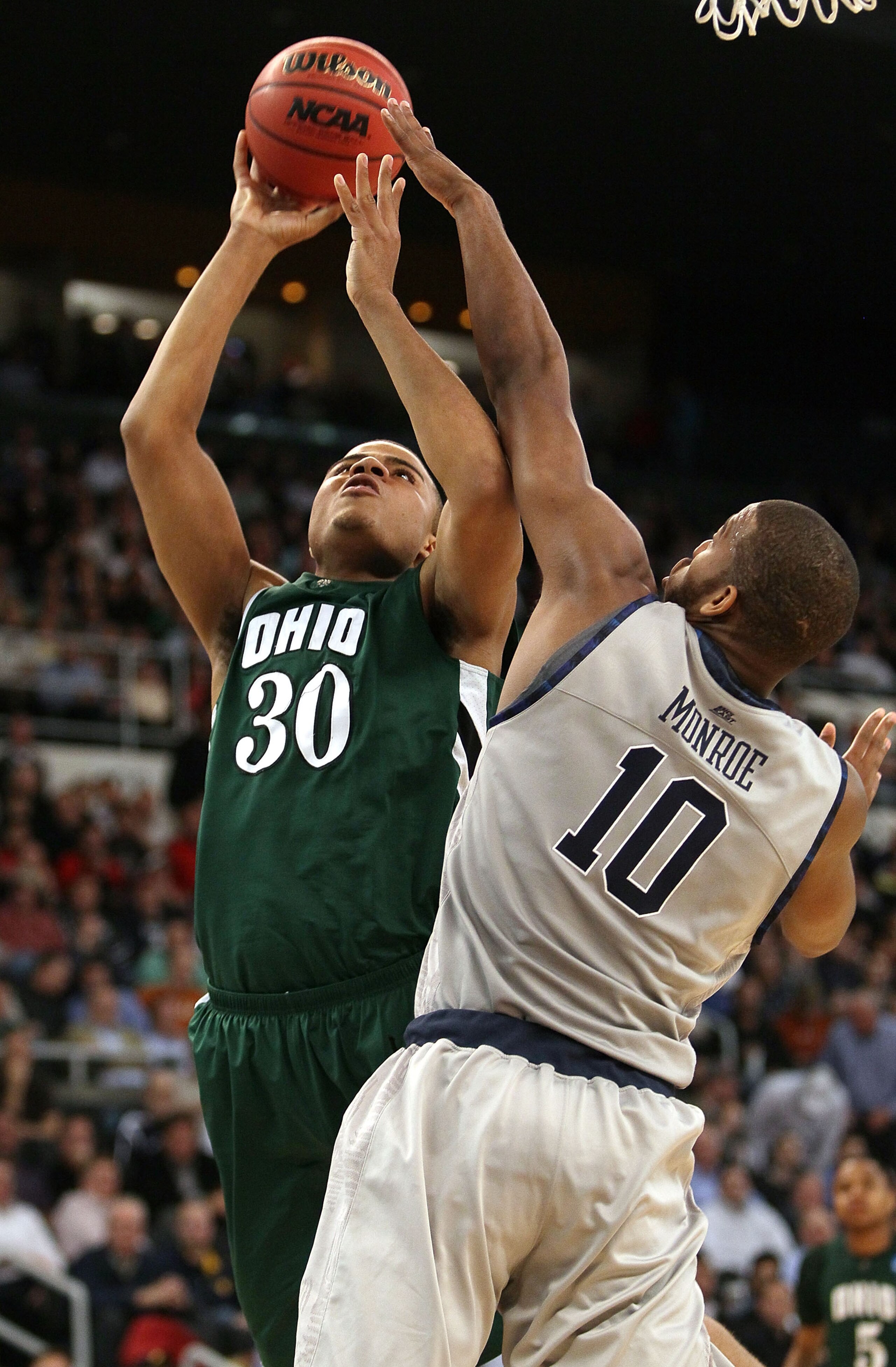 PROVIDENCE, RI - MARCH 18:  Reggie Keely #30 of the Ohio Bobcats takes a shot as Greg Monroe #10 of the Georgetown Hoyas defends during the first round of the 2010 NCAA men's basketball tournament on March 18, 2010 at the Dunkin Donuts Arena in Providence