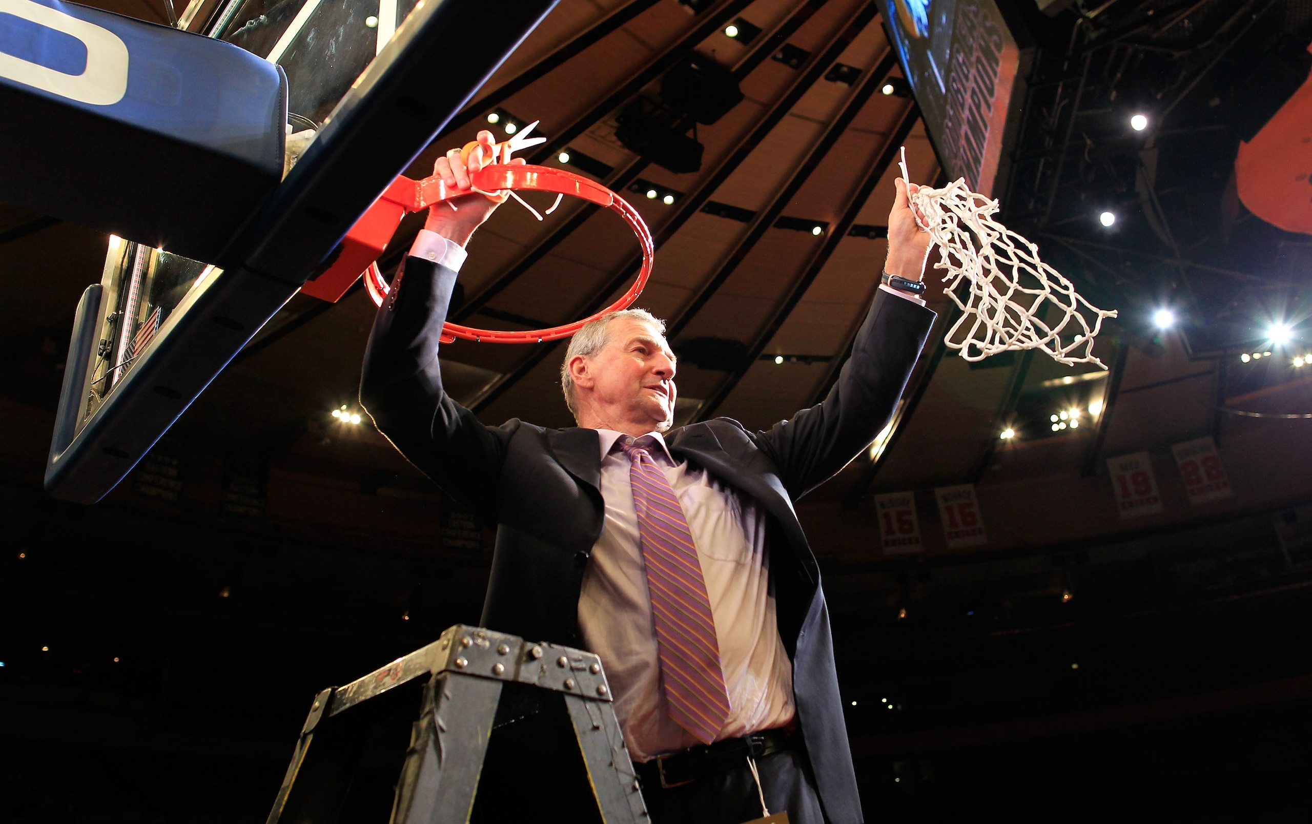 NEW YORK, NY - MARCH 12:  Head coach Jim Calhoun of the Connecticut Huskies cuts down the net after defeating the Louisville Cardinals during the championship of the 2011 Big East Men's Basketball Tournament presented by American Eagle Outfitters at Madis