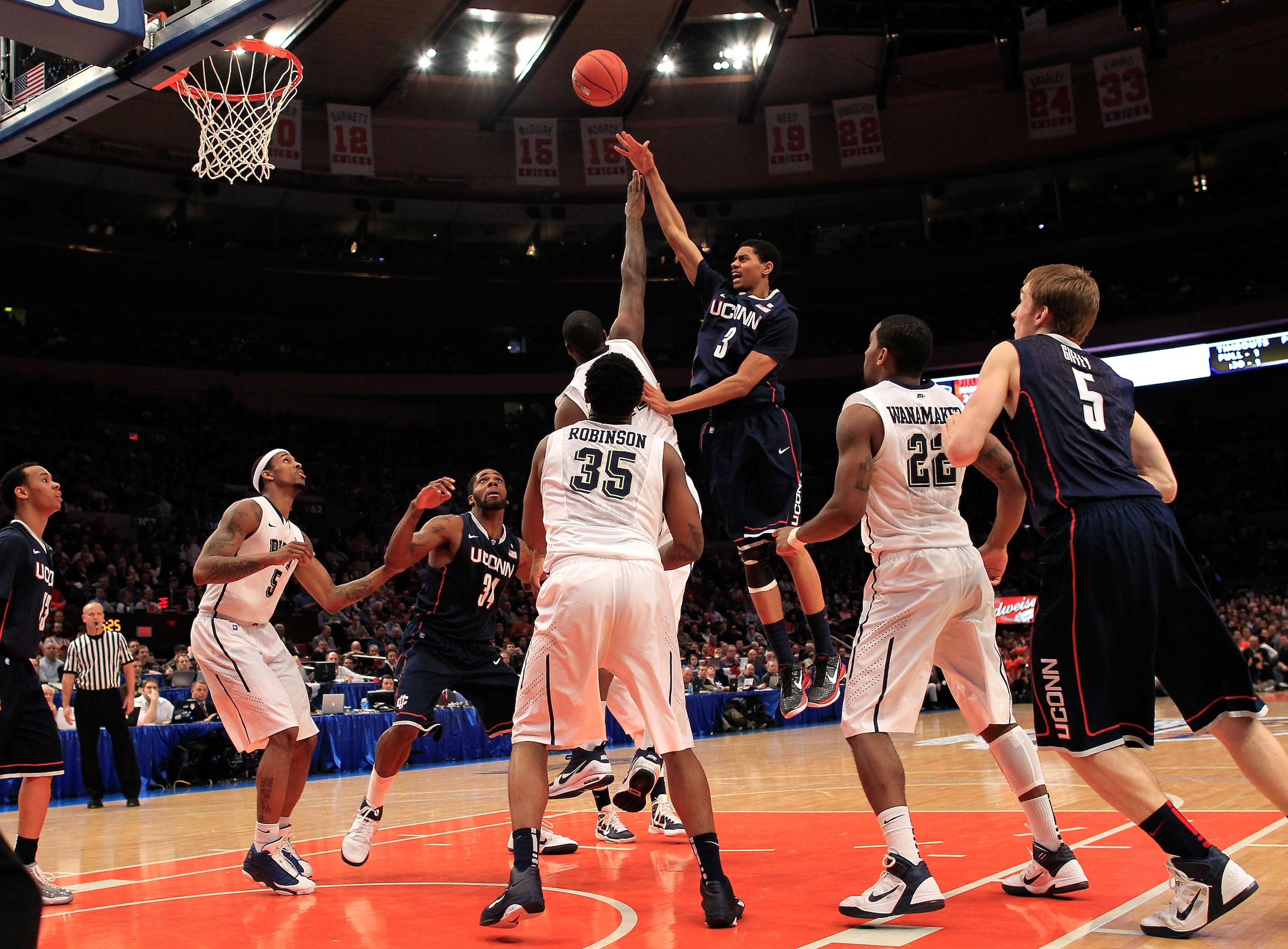 NEW YORK, NY - MARCH 10: Jeremy Lamb #3 of the Connecticut Huskies shoots over Dante Taylor #11 of the Pittsburgh Panthers during the quarterfinals of the 2011 Big East Men's Basketball Tournament presented by American Eagle Outfitters  at Madison Square