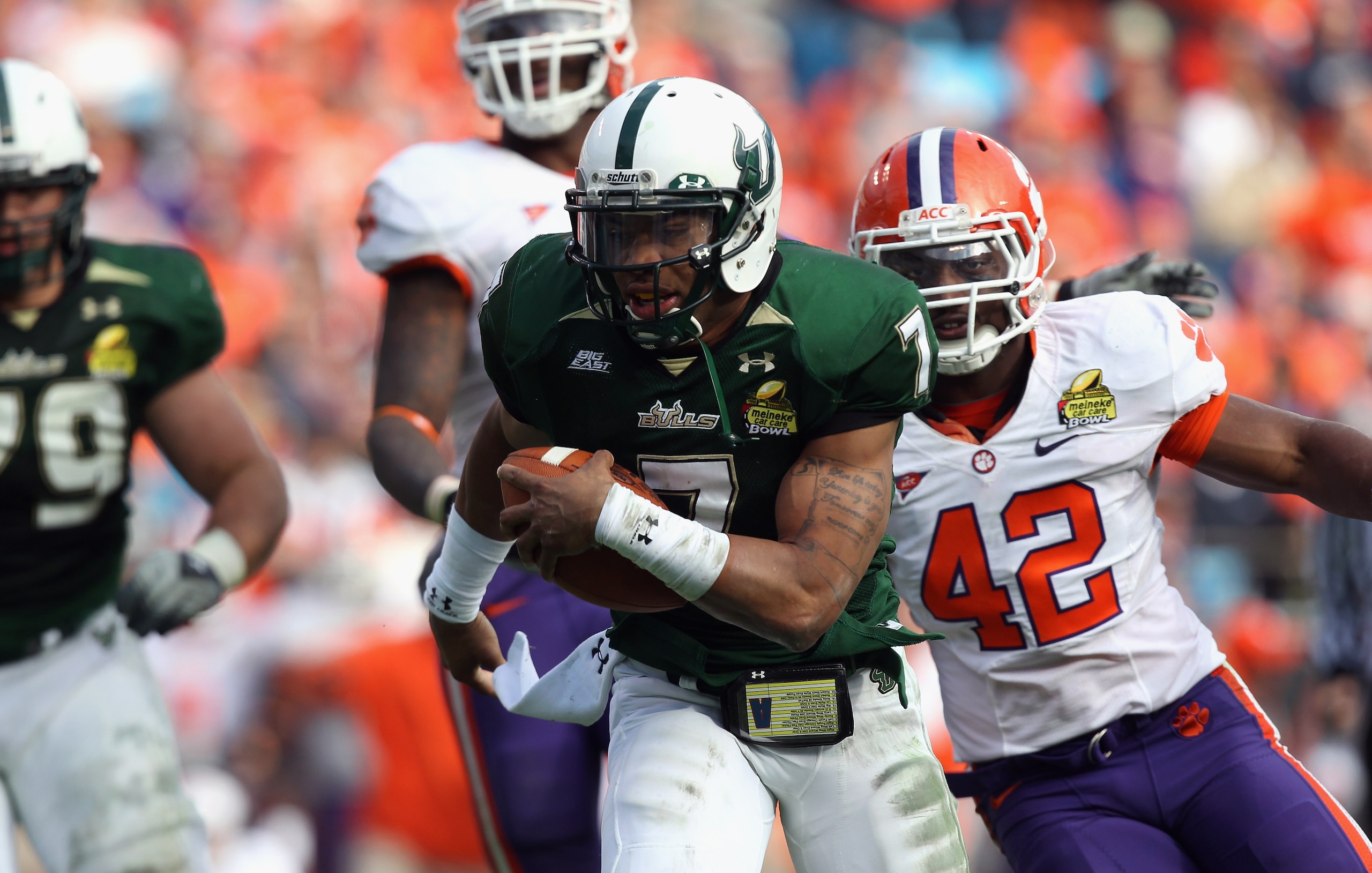 CHARLOTTE, NC - DECEMBER 31: B.J. Daniels #7 of the USF Bulls runs for a touchdown against the Clemson Tigers during their game at Bank of America Stadium on December 31, 2010 in Charlotte, North Carolina. (Photo by Streeter Lecka/Getty Images) CHARLOTTE, NC - DECEMBER 31: B.J. Daniels #7 of the USF Bulls runs for a touchdown against the Clemson Tigers during their game at Bank of America Stadium on December 31, 2010 in Charlotte, North Carolina. (Photo by Streeter Lecka/Getty Images)
