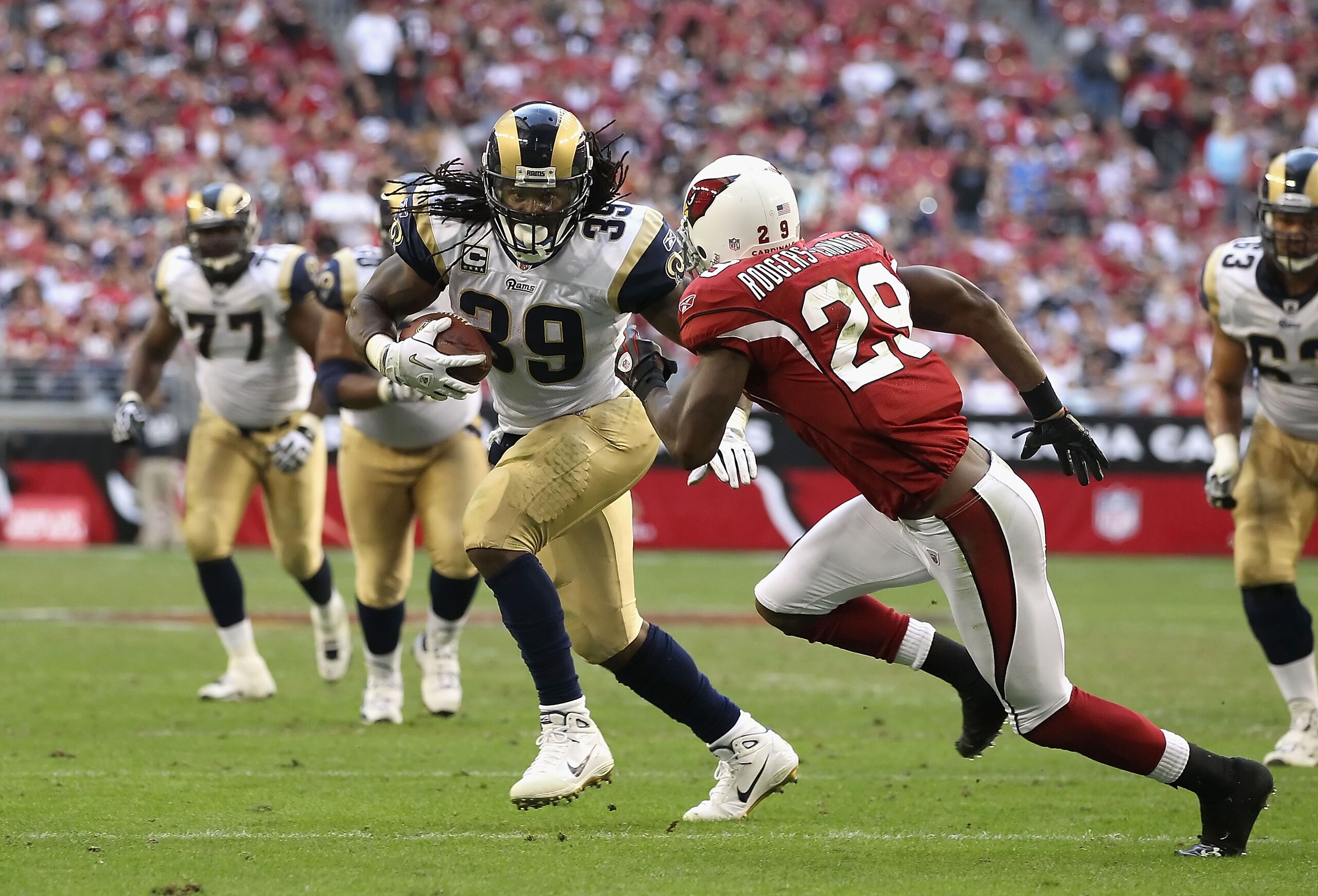 GLENDALE, AZ - DECEMBER 05:  Runningback Steven Jackson #8 of the St. Louis Rams rushes the football against Dominique Rodgers-Cromartie #29 of the Arizona Cardinals during the NFL game at the University of Phoenix Stadium on December 5, 2010 in Glendale,