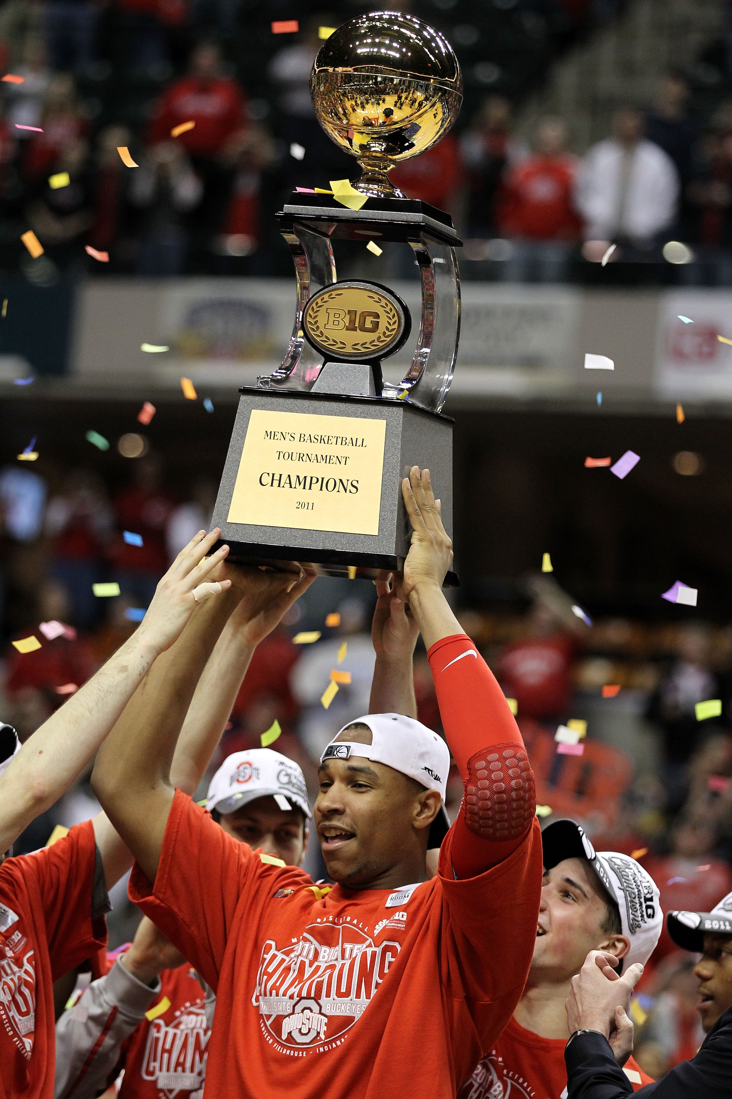 INDIANAPOLIS, IN - MARCH 13: Jared Sullinger #0 of the Ohio State Buckeyes celebrates with the Big Ten Championship trophy after OHio State won 71-60 against the Penn State Nittany Lions during the championship game of the 2011 Big Ten Men's Basketball T INDIANAPOLIS, IN - MARCH 13: Jared Sullinger #0 of the Ohio State Buckeyes celebrates with the Big Ten Championship trophy after OHio State won 71-60 against the Penn State Nittany Lions during the championship game of the 2011 Big Ten Men's Basketball T