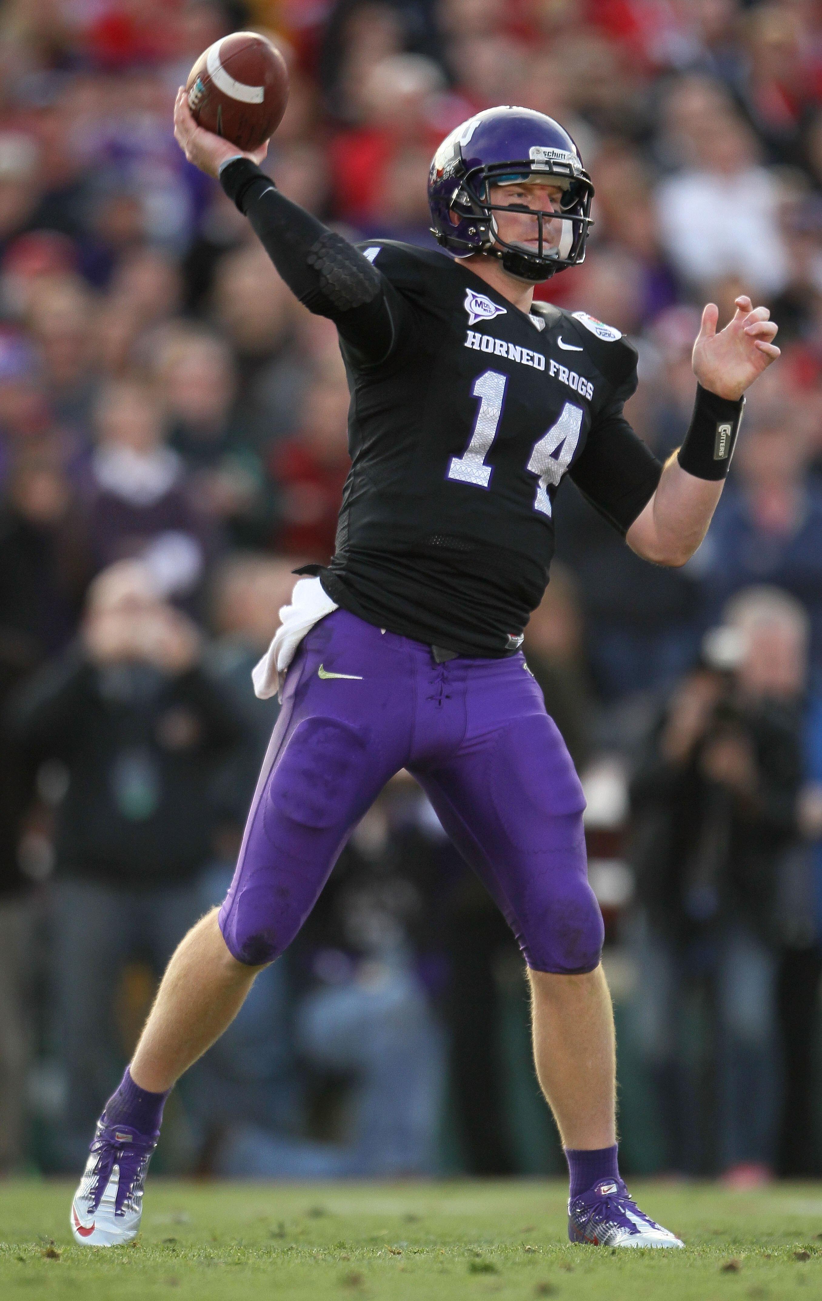 PASADENA, CA - JANUARY 01:  Quarterback Andy Dalton #14 of the TCU Horned Frogs throws a pass against the Wisconsin Badgers in the 97th Rose Bowl game on January 1, 2011 in Pasadena, California.  (Photo by Jeff Gross/Getty Images)