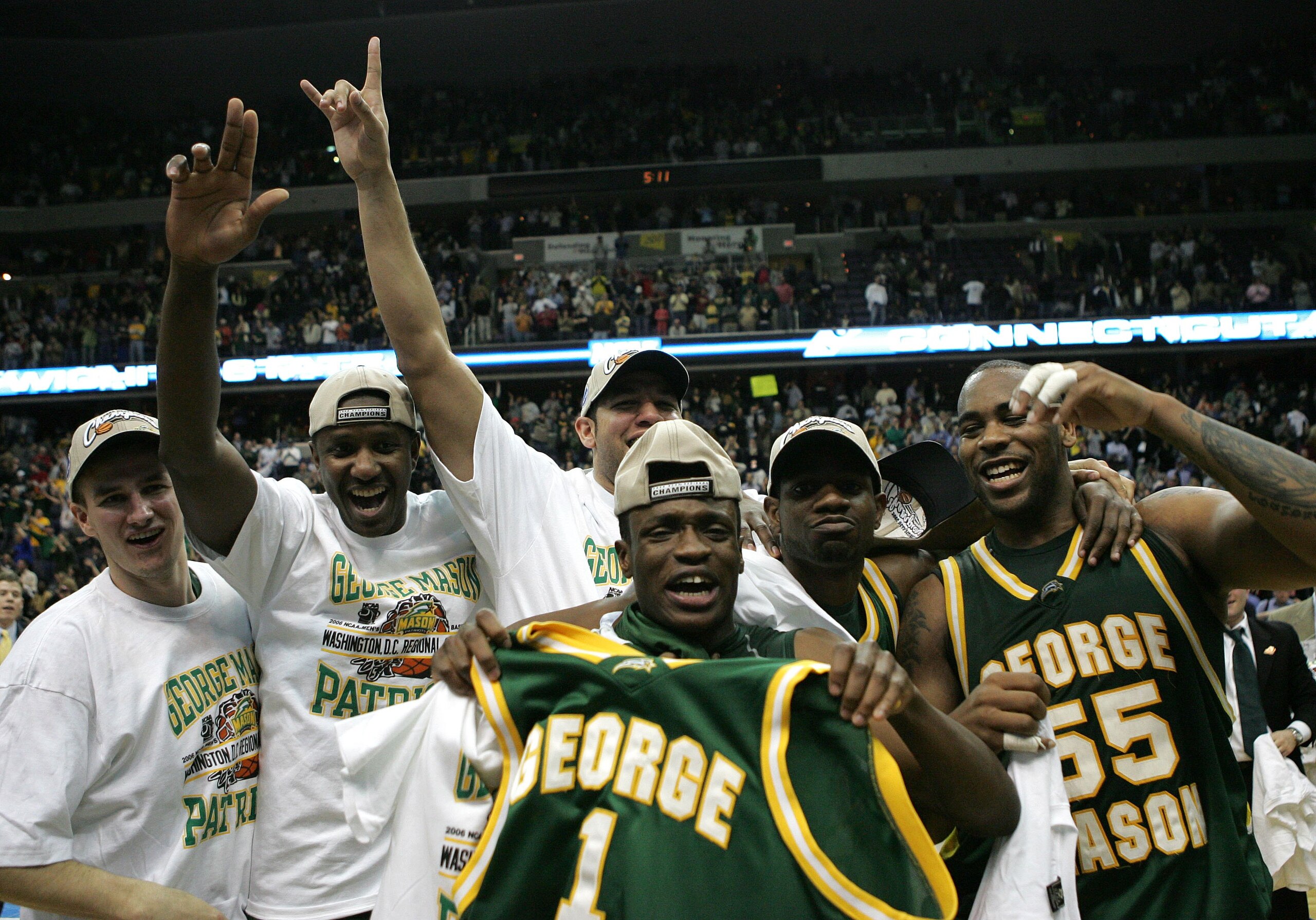 WASHINGTON - MARCH 26:  Tony Skinn #1, Jai Lewis #55 and their teammates celebrate thier win over the Connecticut Huskies during the Regional Finals of the NCAA Men's Basketball Tournament on March 26, 2006 at the Verizon Center in Washington DC. The Geor