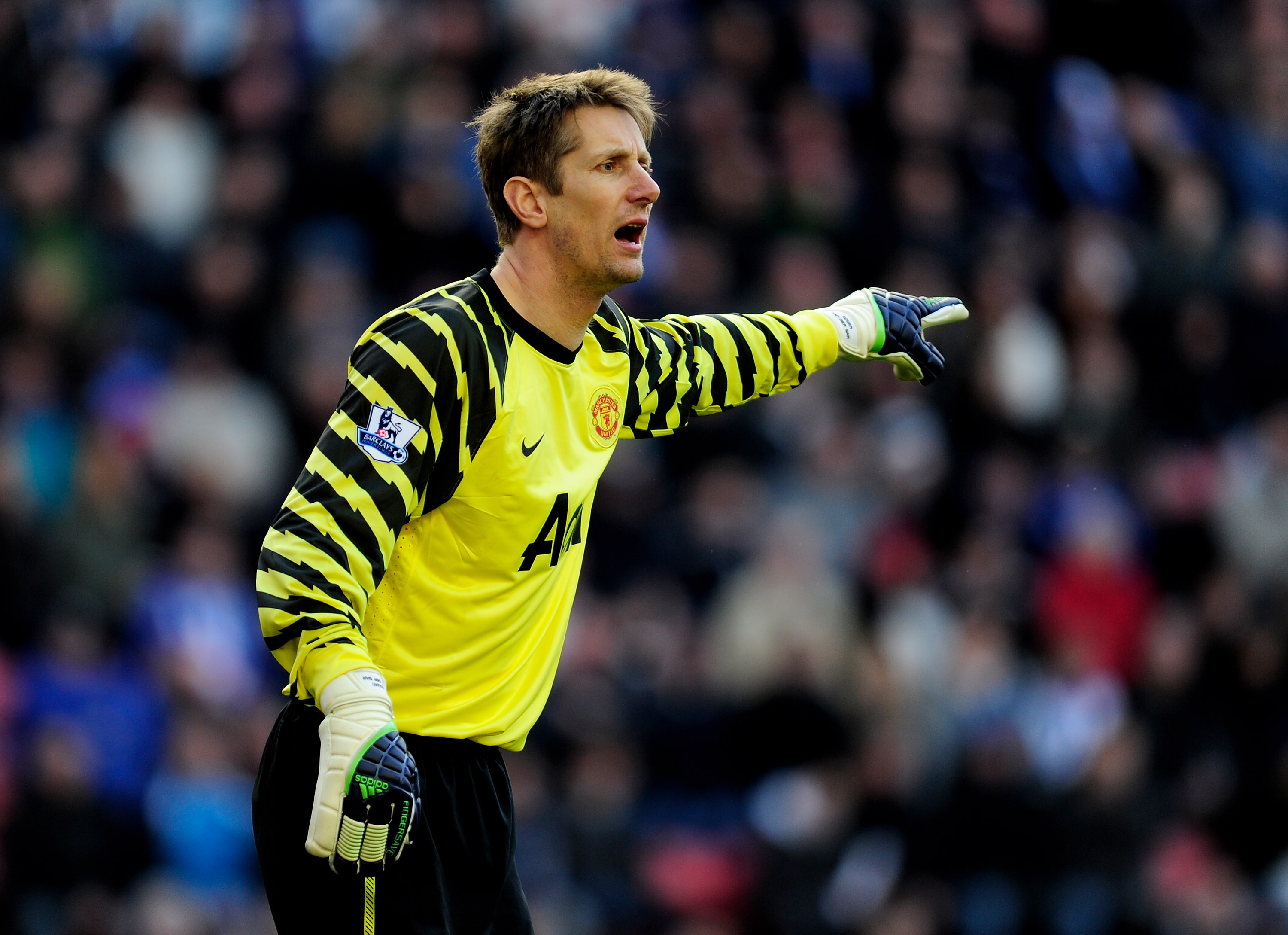 WIGAN, ENGLAND - FEBRUARY 26:  Edwin van der Sar of Manchester United gestures during the Barclays Premier League match between Wigan Athletic and Manchester United at the DW Stadium on February 26, 2011 in Wigan, England.  (Photo by Jamie McDonald/Getty