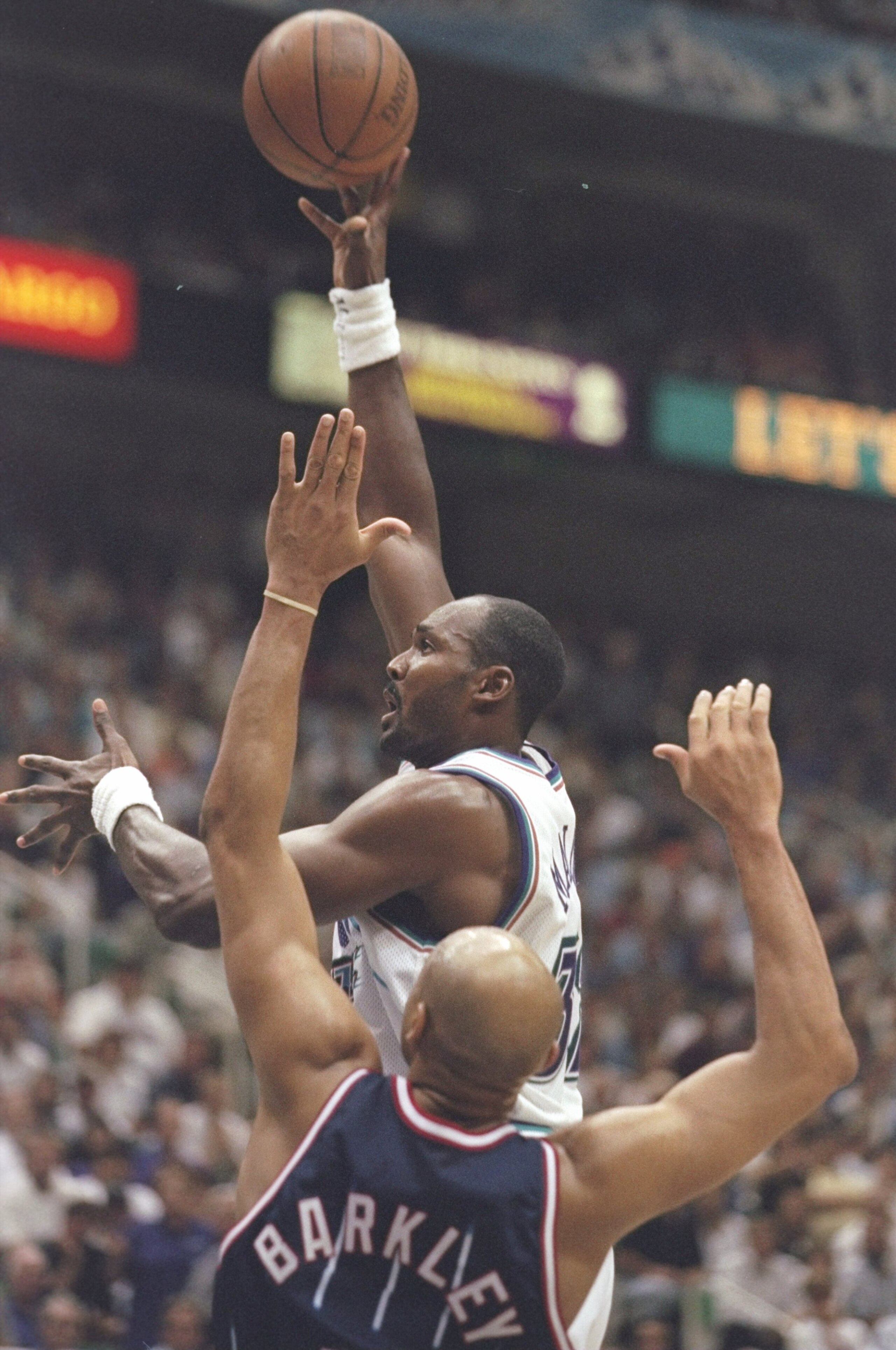 27 May 1997:  Karl Malone #32 of the Utah Jazz goes for a layup over Charles Barkley #$ of the Houston Rockets during the NBA Western Conference Finals Game 5 against the Rockets at Delta Center in Salt Lake City, Utah. Mandatory Credit: Brian Bahr  /Alls