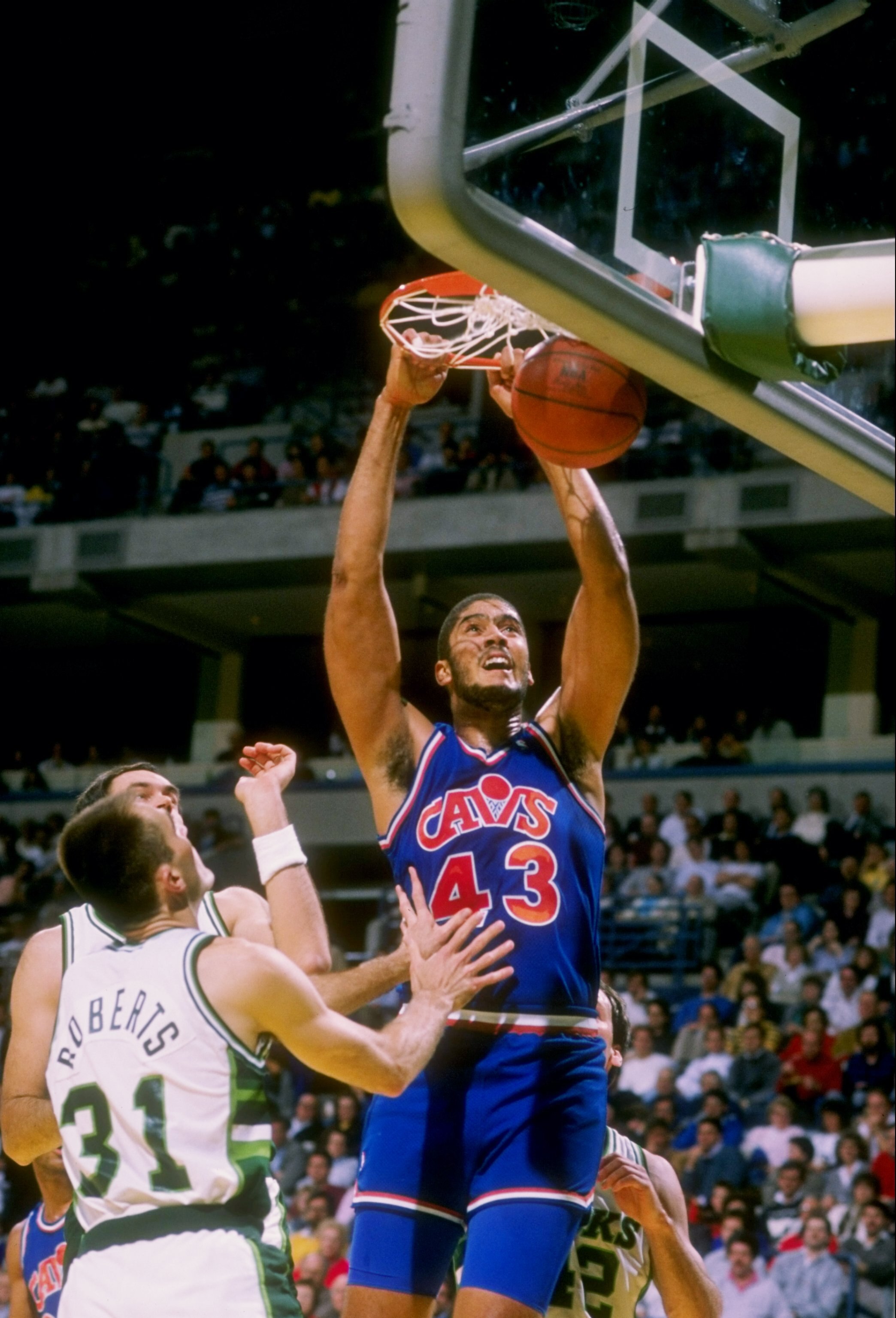 Center Brad Daugherty of the Cleveland Cavaliers sinks the ball during a game.