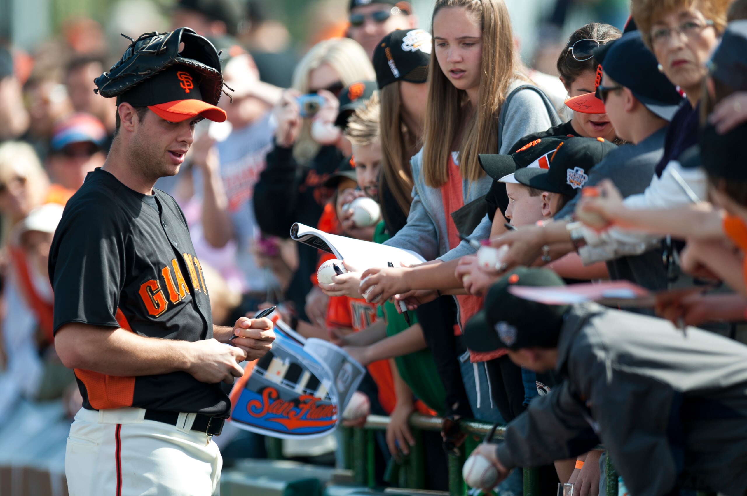 SCOTTSDALE, AZ - FEBRUARY 25: Brandon Belt #9 of the San Francisco Giants signs autographs before a spring training game against the Arizona Diamondbacks at Scottsdale Stadium on February 25, 2011 in Scottsdale, Arizona. (Photo by Rob Tringali/Getty Image