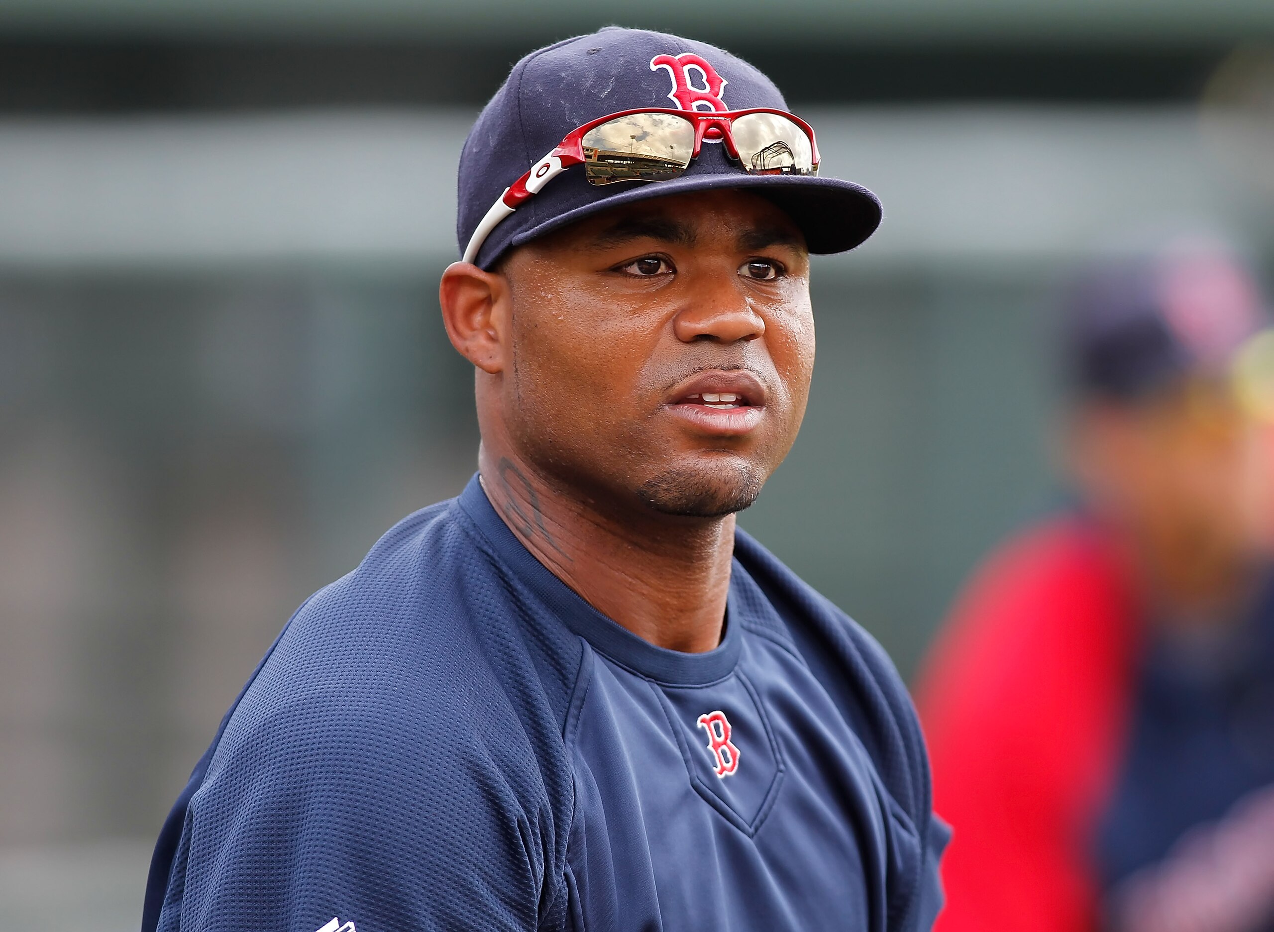 SARASOTA, FL - MARCH 05:  Outfielder Carl Crawford #13 of the Boston Red Sox warms up just before the start of the Grapefruit League Spring Training Game against the Baltimore Orioles at Ed Smith Stadium on March 5, 2011 in Sarasota, Florida.  (Photo by J