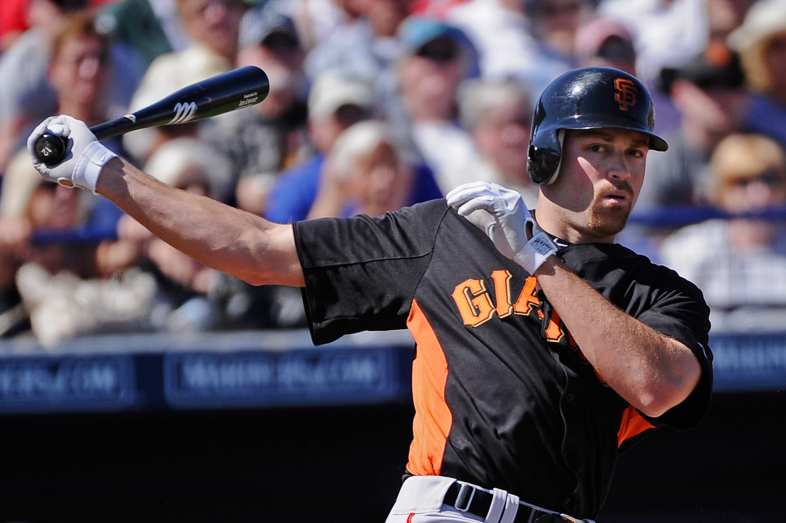 PEORIA, AZ - MARCH 08:  Nate Schierholtz #12 of the San Francisco Giants during the spring training baseball game against Seattle Mariners at Peoria Stadium on March 8, 2011 in Peoria, Arizona.  (Photo by Kevork Djansezian/Getty Images)