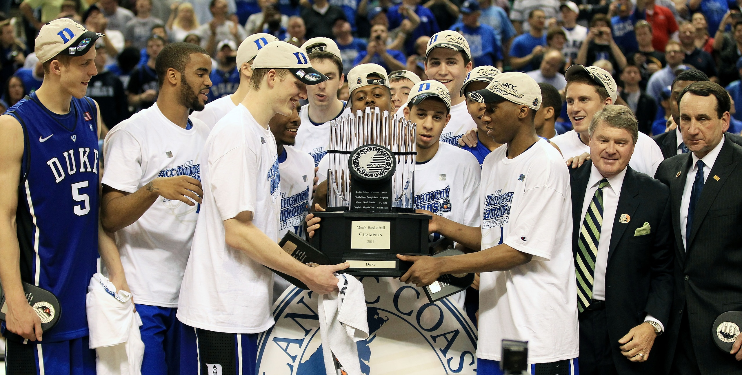 GREENSBORO, NC - MARCH 13:  The Duke Blue Devils celebrate with the ACC Championship Trophy after their 75-58 victory over the North Carolina Tar Heels in the championship game of the 2011 ACC men's basketball tournament at the Greensboro Coliseum on Marc