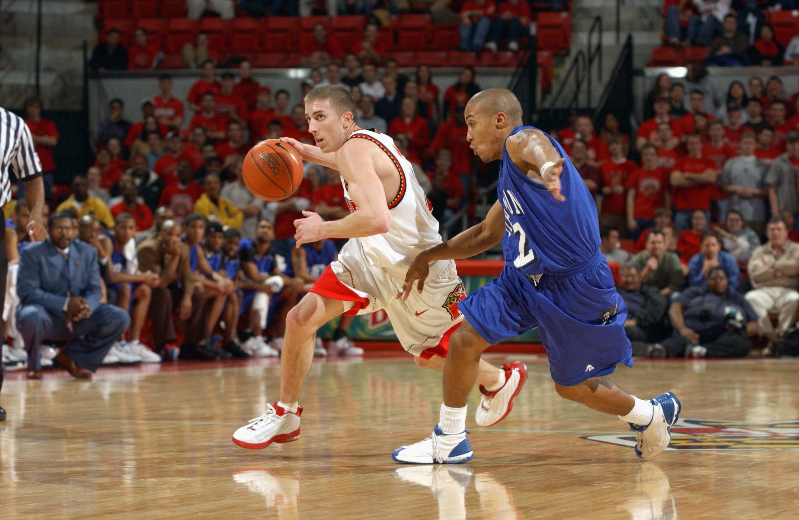 COLLEGE PARK, MD - JANUARY 8:  Steve Blake #25 of the Maryland Terrapins drives against Jamaal James #12 of the Hampton Pirates during the game at Comcast Center on January 8, 2003 in College Park, Maryland.  The Terrapins won 108-58.  (Photo by Doug Pens