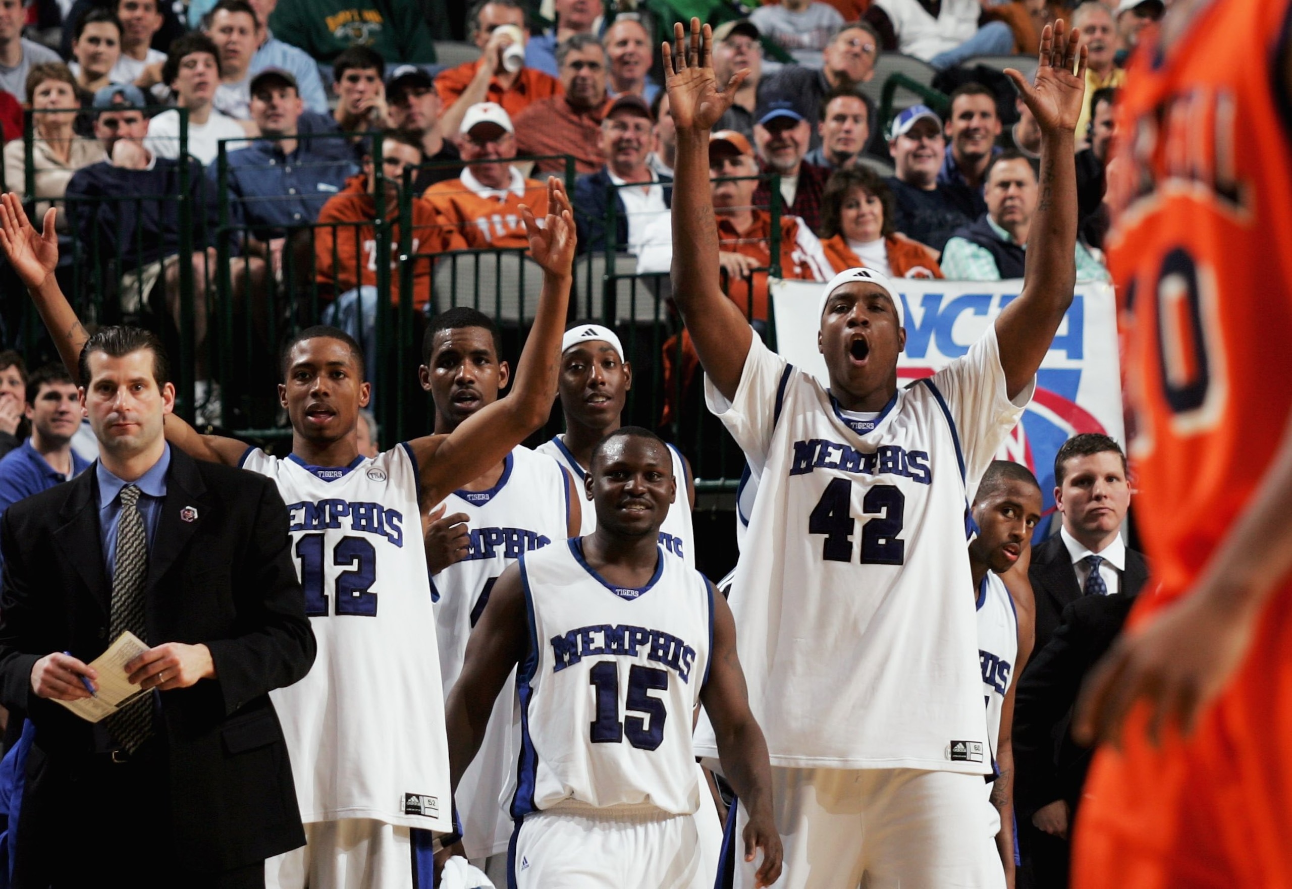 DALLAS, TEXAS - MARCH 19:  Antonio Anderson #12, Andre Allen #15 and Kareem Cooper #42 of the Memphis Tigers celebrate from the bench in the final minutes before defeating the Bucknell Bison in the Second Round game of the 2006 NCAA Division 1 Men's Baske
