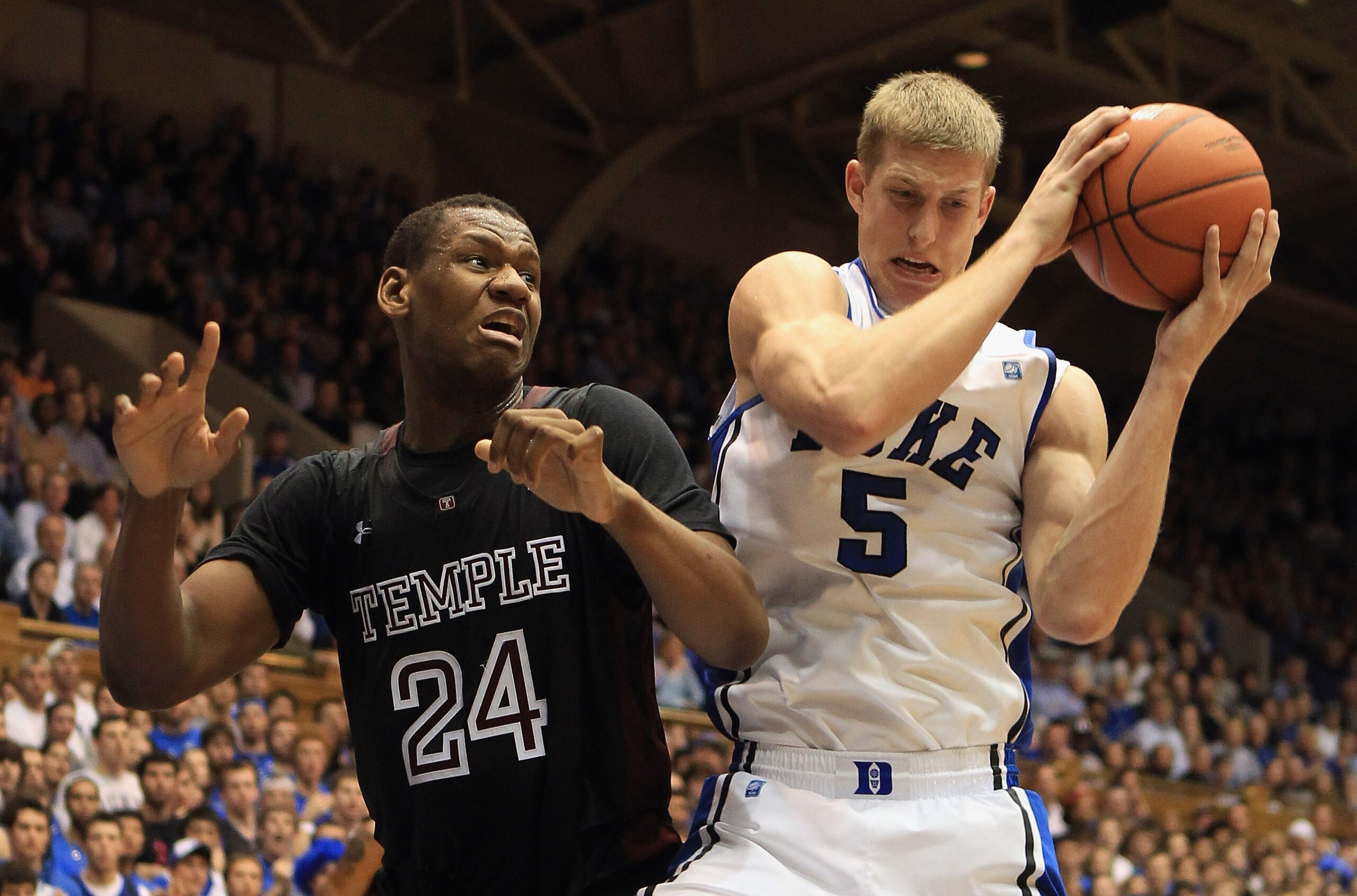 DURHAM, NC - FEBRUARY 23: Lavoy Allen #24 of the Temple Owls battles for a loose ball with Mason Plumlee #5 of the Duke Blue Devils during their game at Cameron Indoor Stadium on February 23, 2011 in Durham, North Carolina.  (Photo by Streeter Lecka/Getty