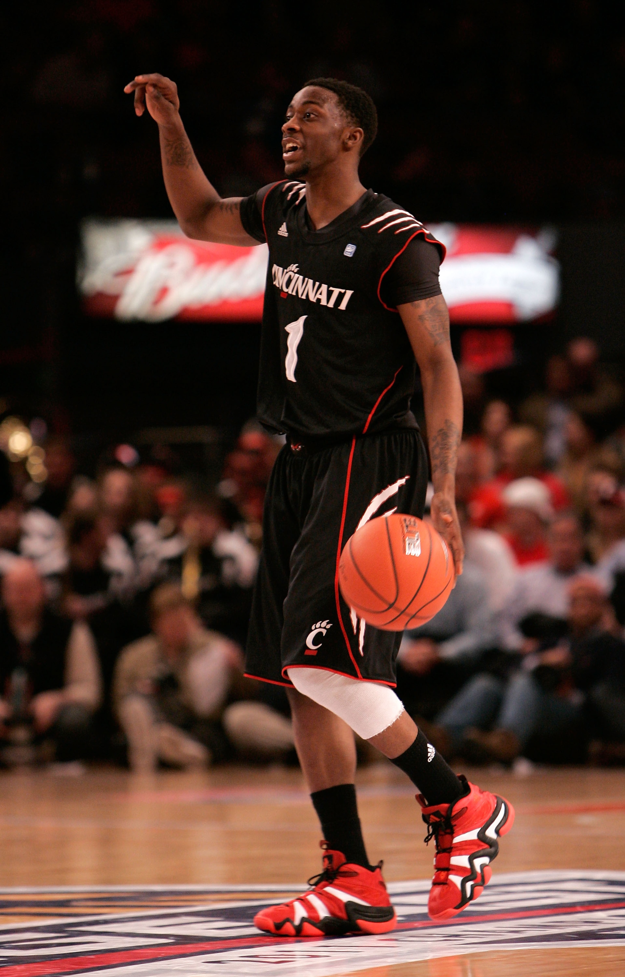NEW YORK, NY - MARCH 10:  Cashmere Wright #1 of the Cincinnati Bearcats brings the ball up court against the Notre Dame Fighting Irish during the quarterfinals of the 2011 Big East Men's Basketball Tournament presented by American Eagle Outfitters  at Mad