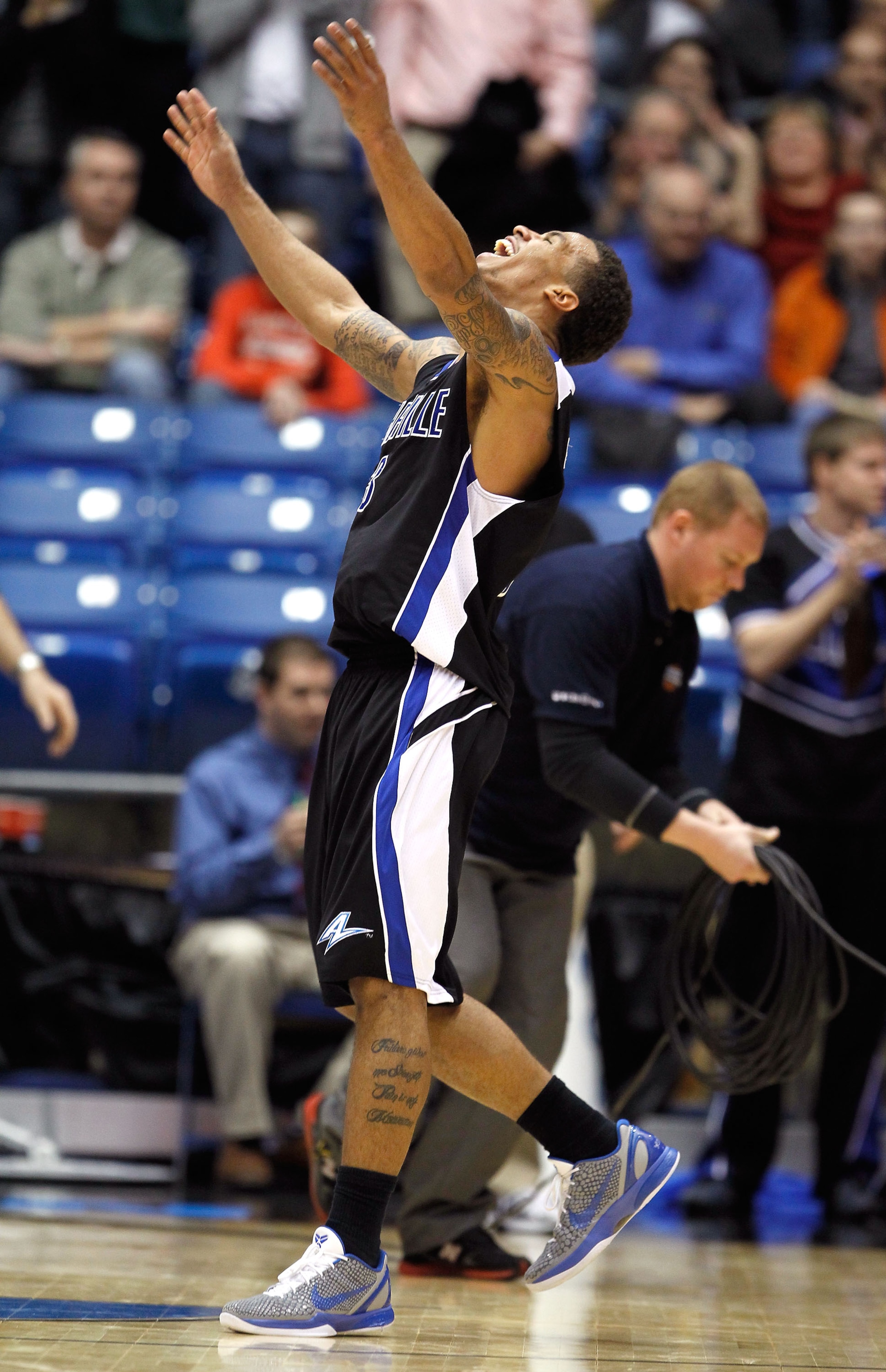 DAYTON, OH - MARCH 15:  J.P. Primm #3 of the North Carolina-Asheville Bulldogs celebrates after defeating the Arkansas Little Rock Trojans during the first round of the 2011 NCAA men's basketball tournament at UD Arena on March 15, 2011 in Dayton, Ohio.