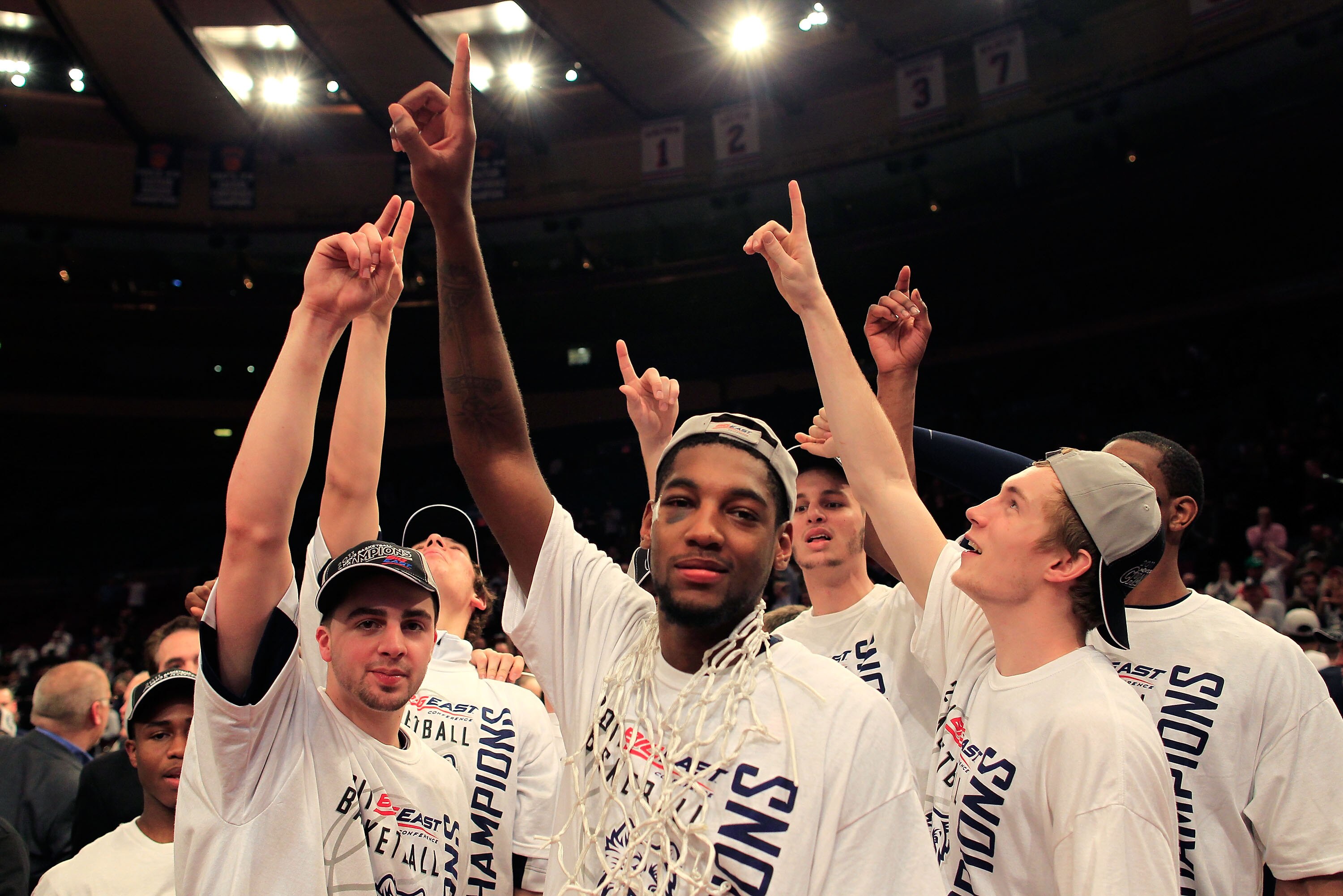 NEW YORK, NY - MARCH 12: Roscoe Smith #22 of the Connecticut Huskies (C) celebrates with teammates after defeating the Louisville Cardinals during the championship of the 2011 Big East Men's Basketball Tournament presented by American Eagle Outfitters at