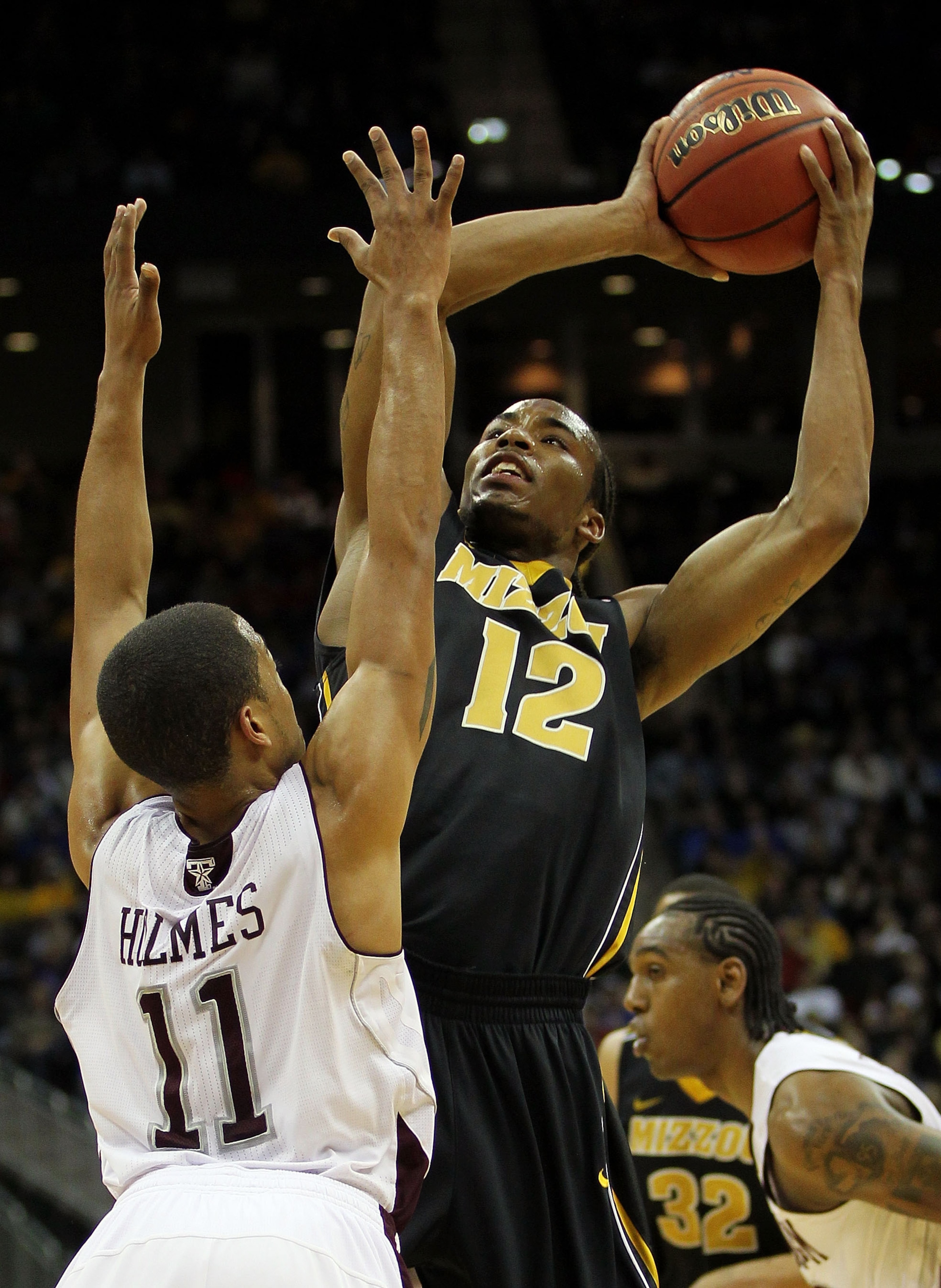KANSAS CITY, MO - MARCH 10: Marcus Denmon #12 of the Missouri Tigers goes up for a shot against B.J. Holmes #11 of the Texas A&M Aggies during their quarterfinal game in the 2011 Phillips 66 Big 12 Men's Basketball Tournament at Sprint Center on March 10 KANSAS CITY, MO - MARCH 10: Marcus Denmon #12 of the Missouri Tigers goes up for a shot against B.J. Holmes #11 of the Texas A&M Aggies during their quarterfinal game in the 2011 Phillips 66 Big 12 Men's Basketball Tournament at Sprint Center on March 10