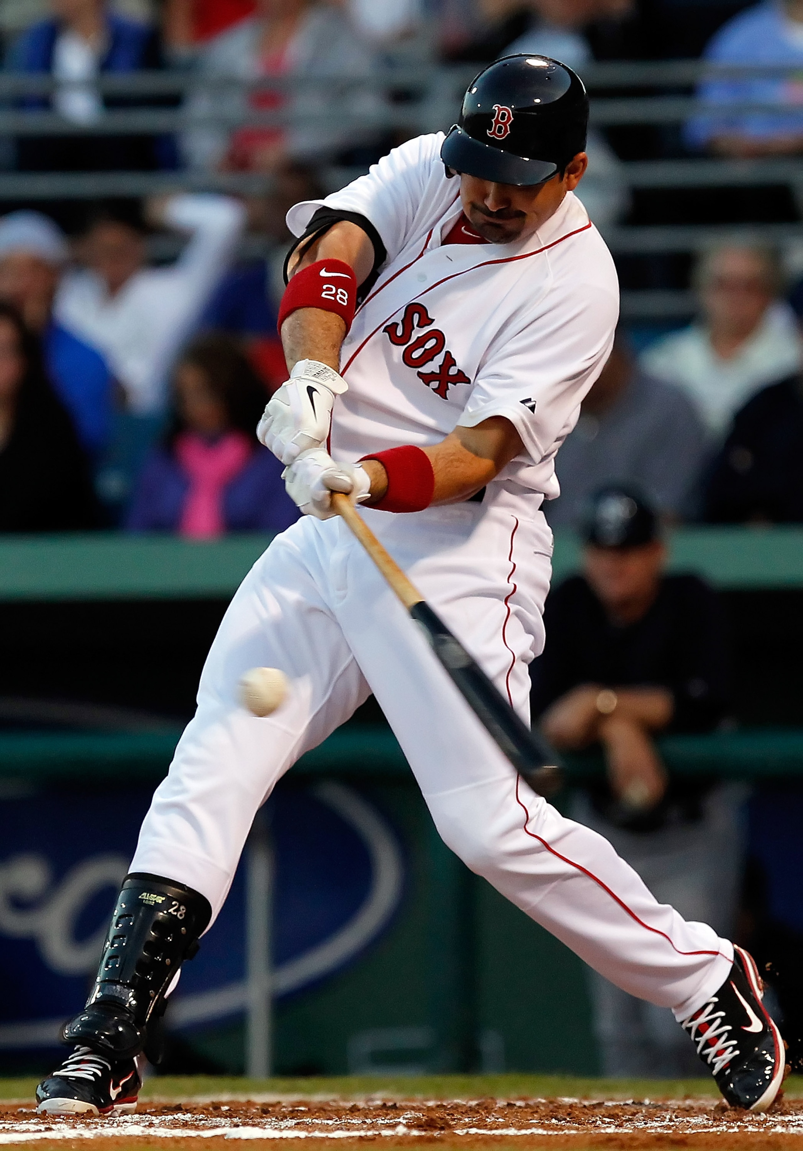 FORT MYERS, FL - MARCH 14:  Infielder Adrian Gonzalez #28 of the Boston Red Sox bats against the New York Yankees during a Grapefruit League Spring Training Game at City of Palms Park on March 14, 2011 in Fort Myers, Florida.  (Photo by J. Meric/Getty Ima