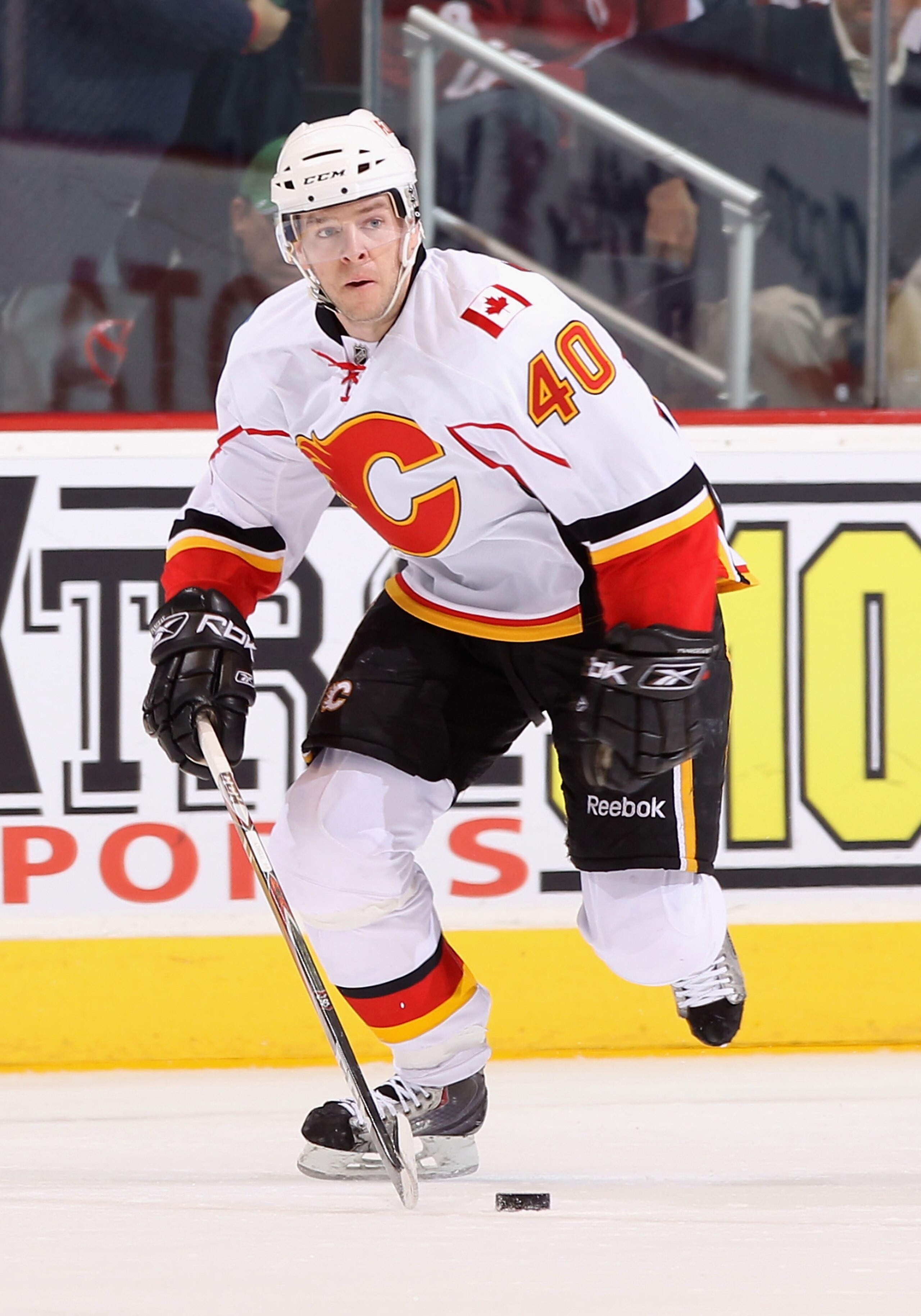 GLENDALE, AZ - MARCH 10:  Alex Tanguay #40 of the Calgary Flames skates with the puck during the NHL game against the Phoenix Coyotes at Jobing.com Arena on March 10, 2011 in Glendale, Arizona.  The Coyotes defeated the Flames 3-0.  (Photo by Christian Pe