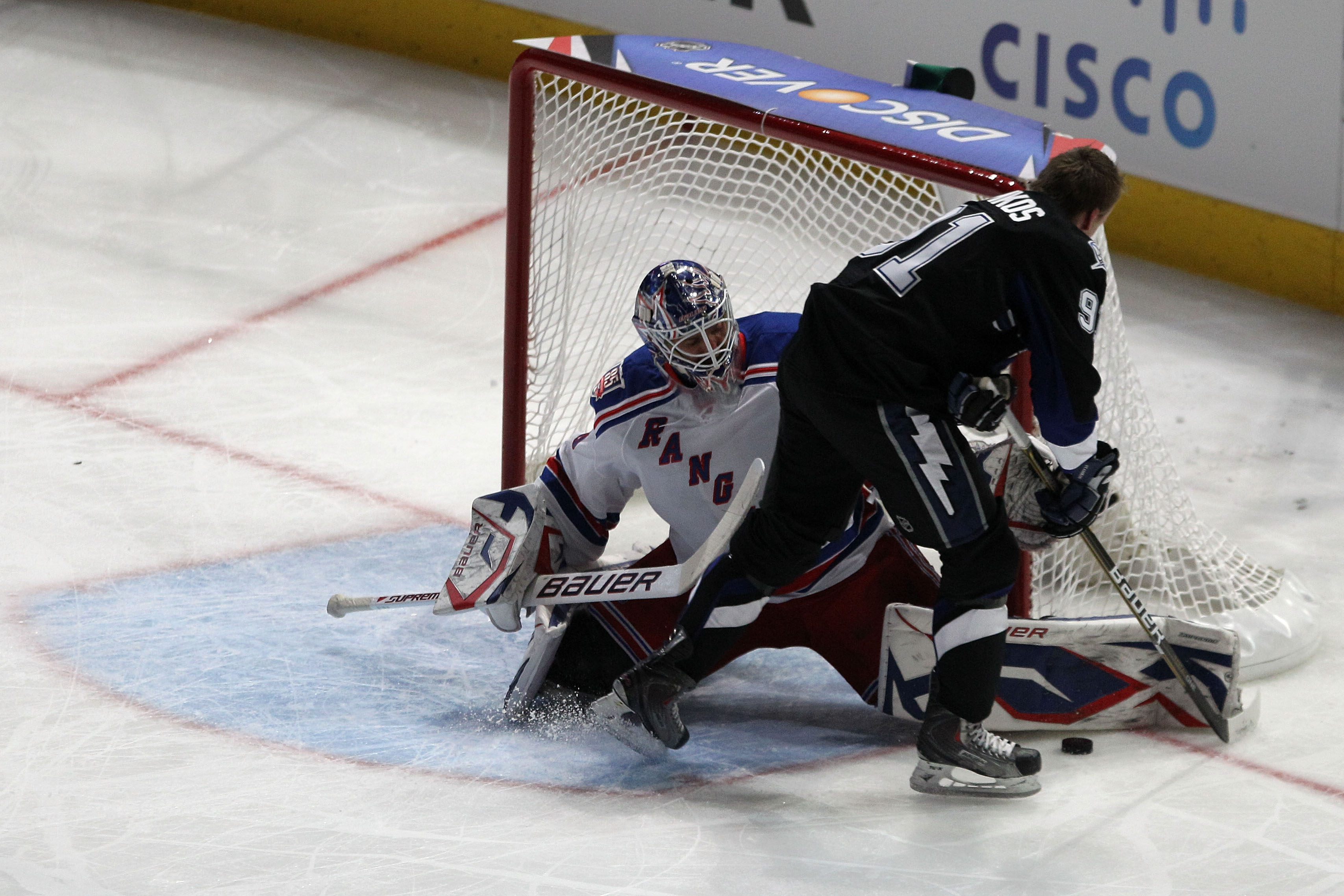 RALEIGH, NC - JANUARY 29:  Steven Stamkos #91 of the Tampa Bay Lightning shoots against Henrik Lundqvist #30 of New York Rangers during the elimination shootout part of the Honda NHL SuperSkills competition part of 2011 NHL All-Star Weekend at the RBC Cen
