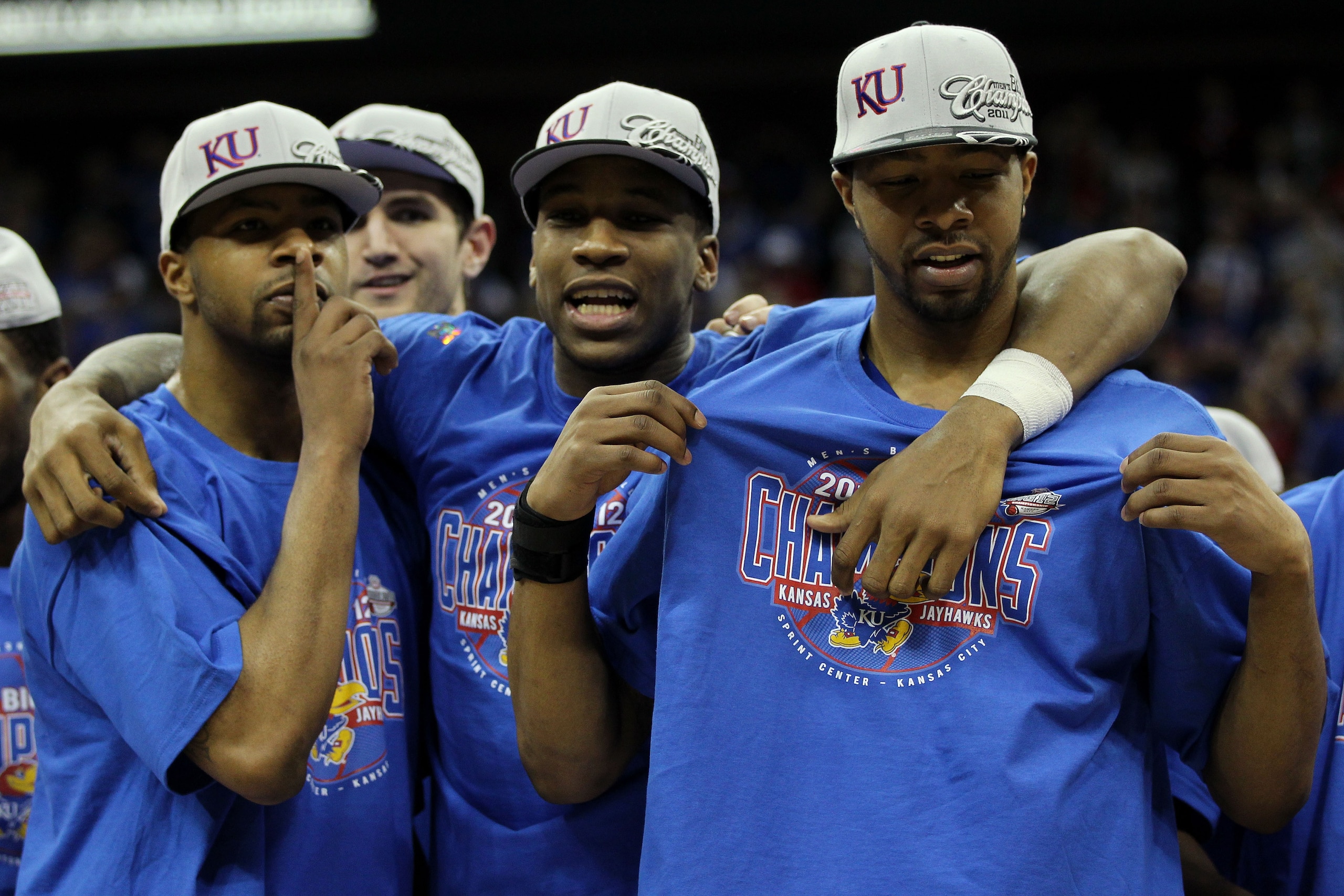 KANSAS CITY, MO - MARCH 12:  (L-R) Marcus Morris #22, Thomas Robinson #0 and Markieff Morris #21 of the Kansas Jayhawks celebrate after defeating the Texas Longhorns 85-73 to win the 2011 Phillips 66 Big 12 Men's Basketball Tournament championship game at