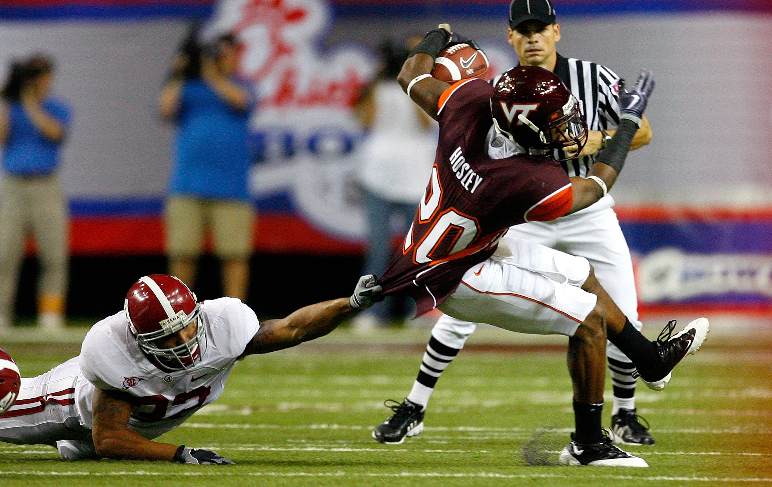 ATLANTA - SEPTEMBER 05:  Cornerback Jayron Hosley #20 of the Virginia Tech Hokies breaks a tackle by Eryk Anders #32 of the Alabama Crimson Tide during the Chick-fil-A Kickoff Game at Georgia Dome on September 5, 2009 in Atlanta, Georgia.  (Photo by Kevin