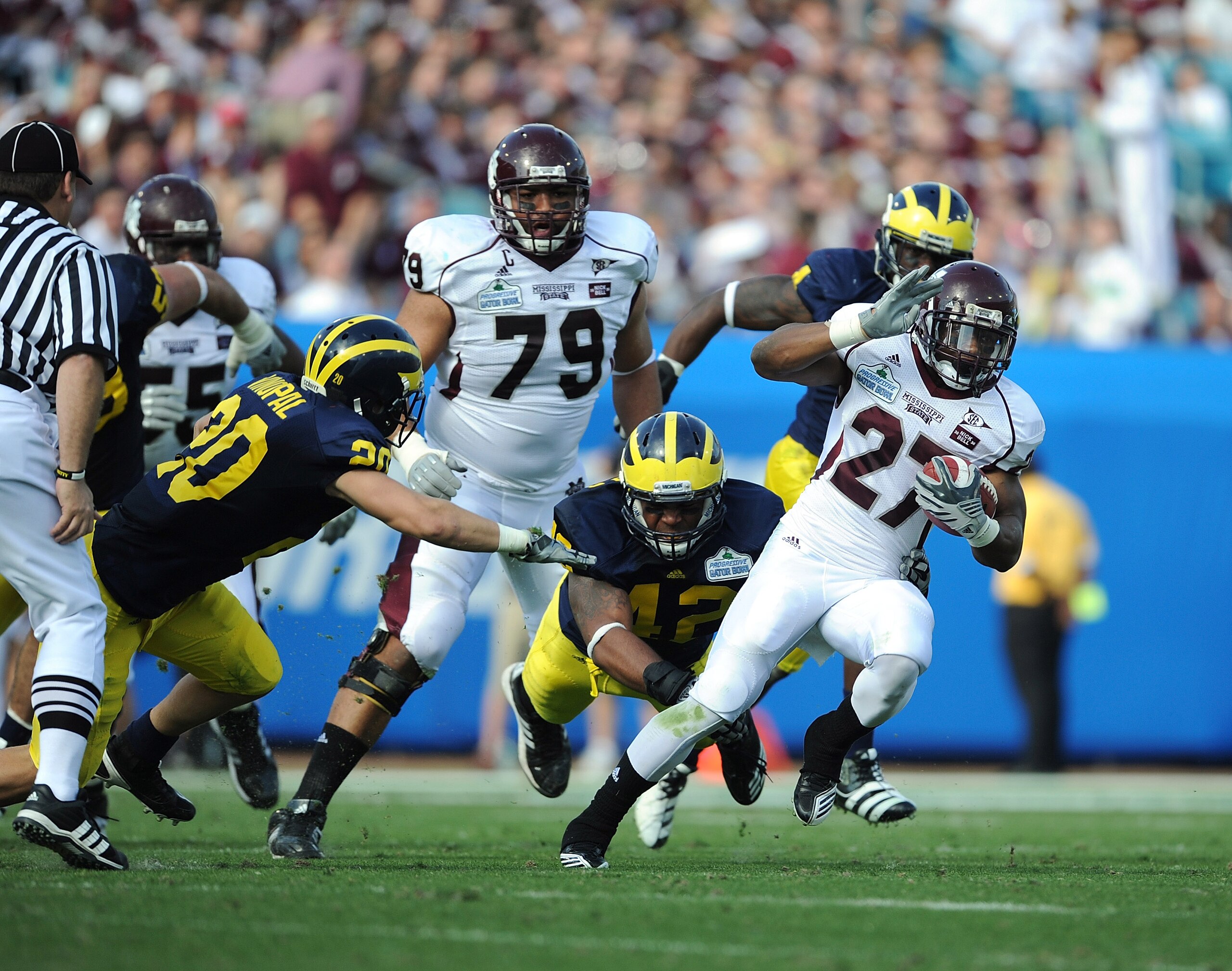 JACKSONVILLE, FL - JANUARY 01:  LaDarius Perkins # 27 of the Mississippi State Bulldogs rushes against the Michigan Wolverines during the Gator Bowl at EverBank Field on January 1, 2011 in Jacksonville, Florida  (Photo by Rick Dole/Getty Images)