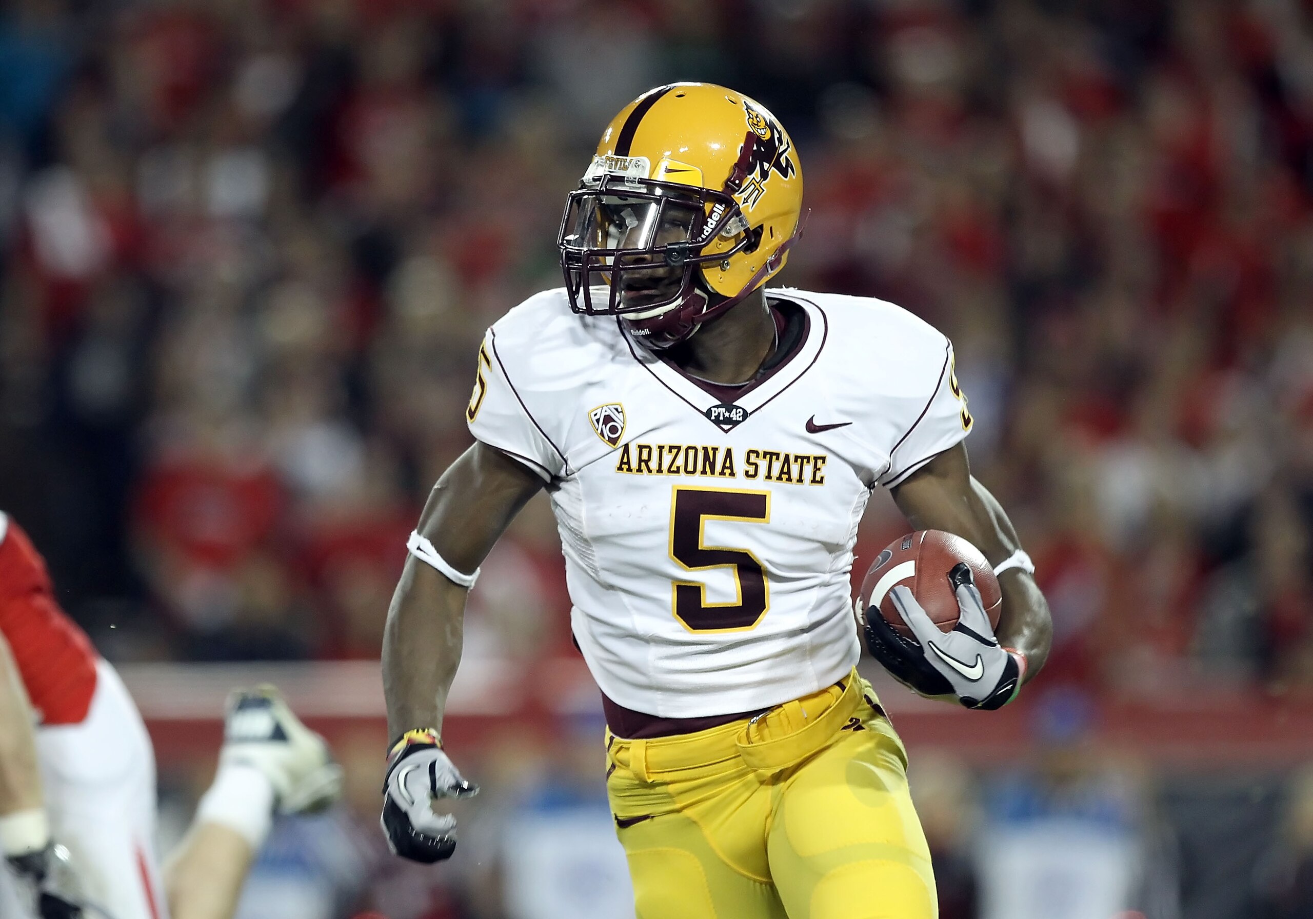 TUCSON, AZ - DECEMBER 02:  Wide receiver Kerry Taylor #5 of the Arizona State Sun Devils runs with the football during the college football game at Arizona Stadium on December 2, 2010 in Tucson, Arizona. The Sun Devils defeated the Wildcats 30-29 in doubl