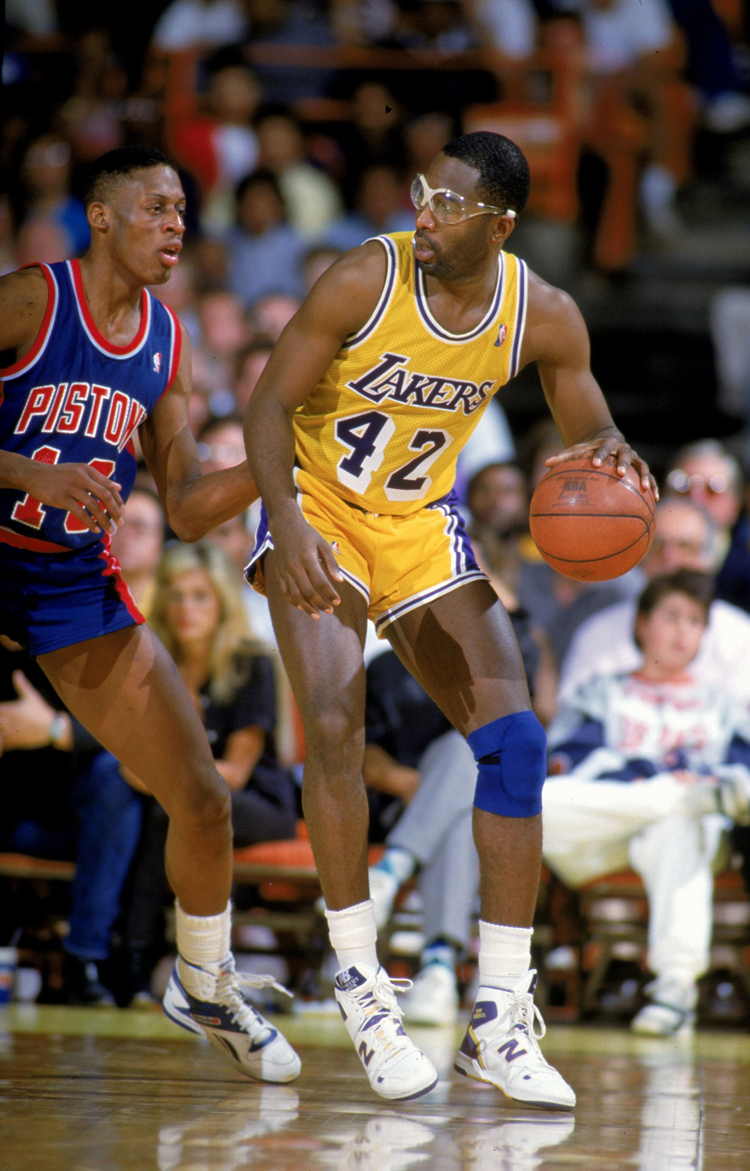 Undated: James Worthy #42 of the Los Angeles Lakers dribbles the ball during a game against the Detroit Pistons.   Mandatory Credit: Rick Stewart  /Allsport