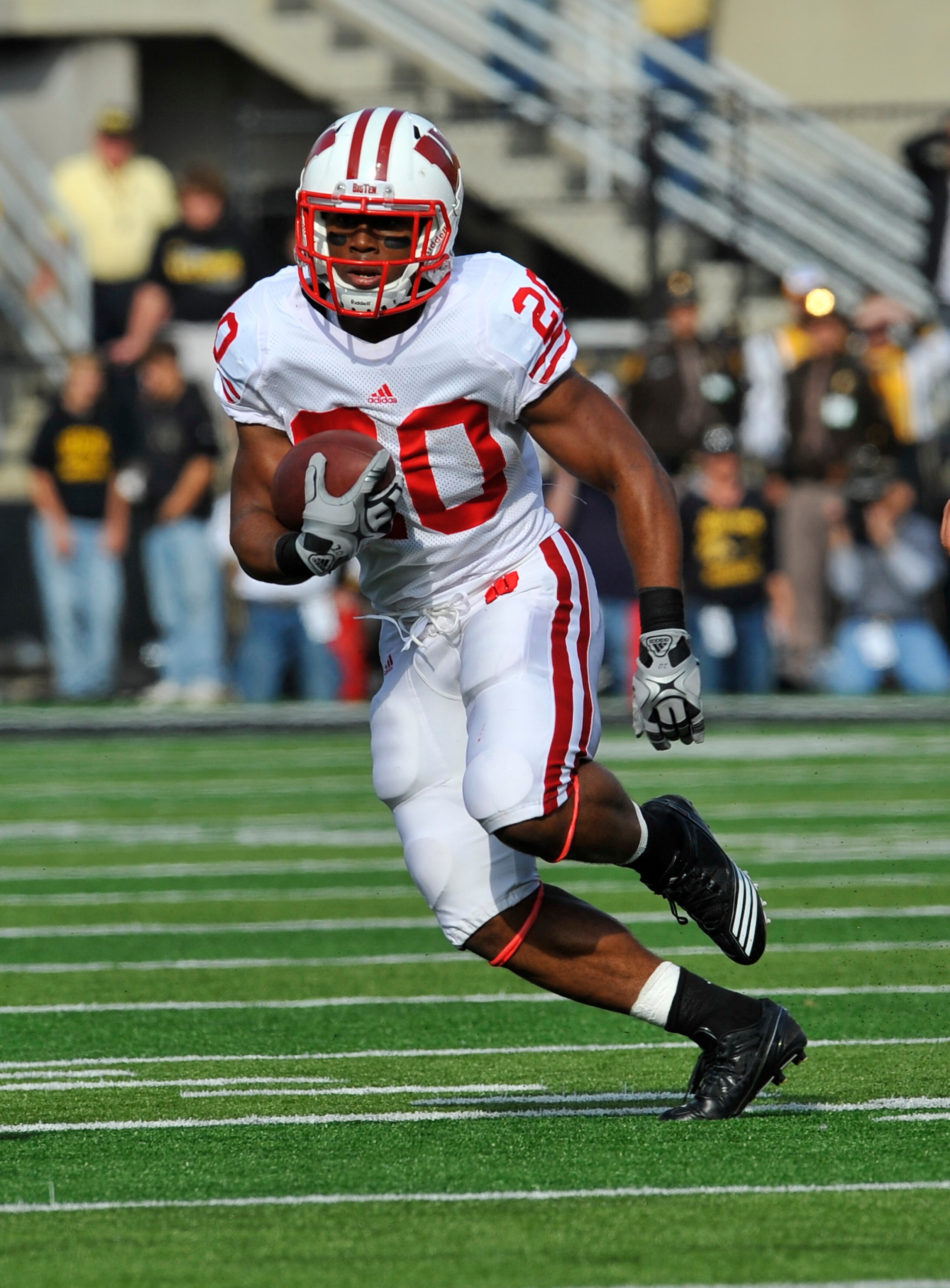 IOWA CITY, IA - OCTOBER 23- Running back James White #20 of the Wisconsin Badgers drives the ball down field against the University of Iowa Hawkeyes during the first half of play at Kinnick Stadium on October 23, 2010 in Iowa City, Iowa. Wisconsin won 31-
