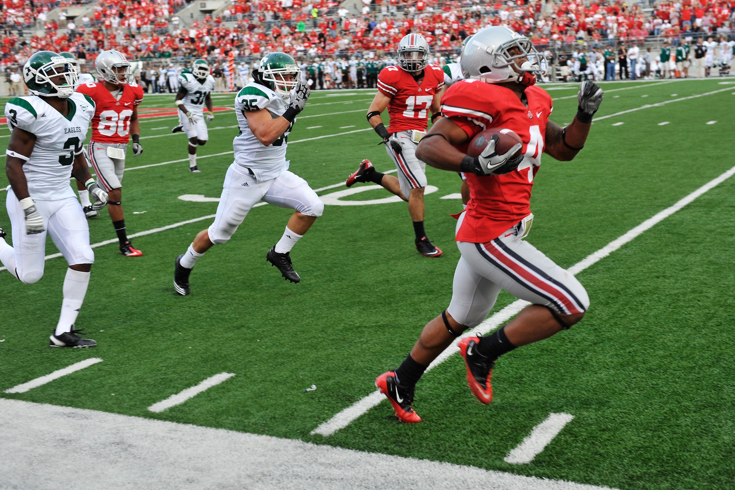 COLUMBUS, OH - SEPTEMBER 25:  Jaamal Berry #4 of the Ohio State Buckeyes races down the sideline on a 67-yard touchdown run in the fourth quarter against the Eastern Michigan Eagles at Ohio Stadium on September 25, 2010 in Columbus, Ohio. Ohio State defea